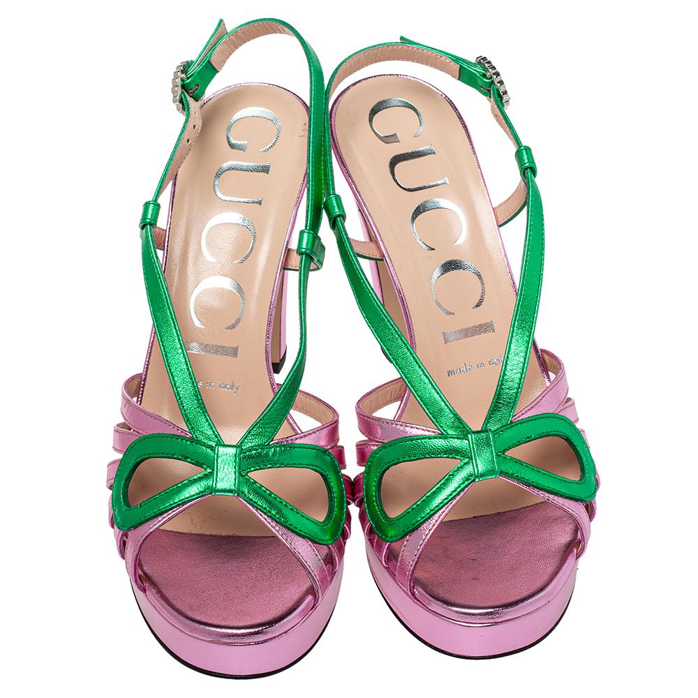 Turn heads as you slip into these strappy sandals by Gucci. They have been crafted from quality leather and come in lovely metallic hues of pink and green. They have platforms, bow detailing on the uppers, buckle slingbacks and 10.5 cm heels. They