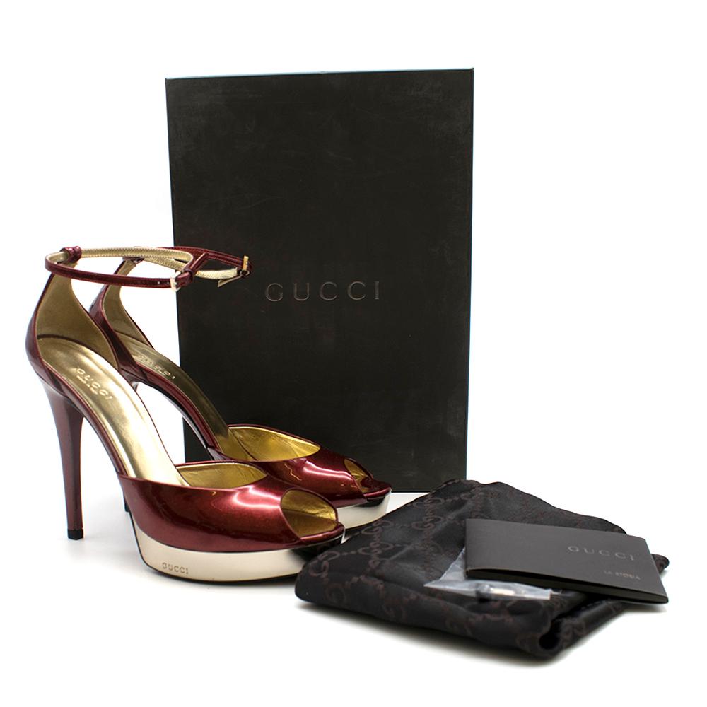 Gucci Metallic Red Platform Sandals

Gold hardware plated platform
Rounded peep toe
Ankle strap
Sparkly red patent finish
Extra pair of heel bases attached

Please note, these items are pre-owned and may show signs of being stored even when unworn
