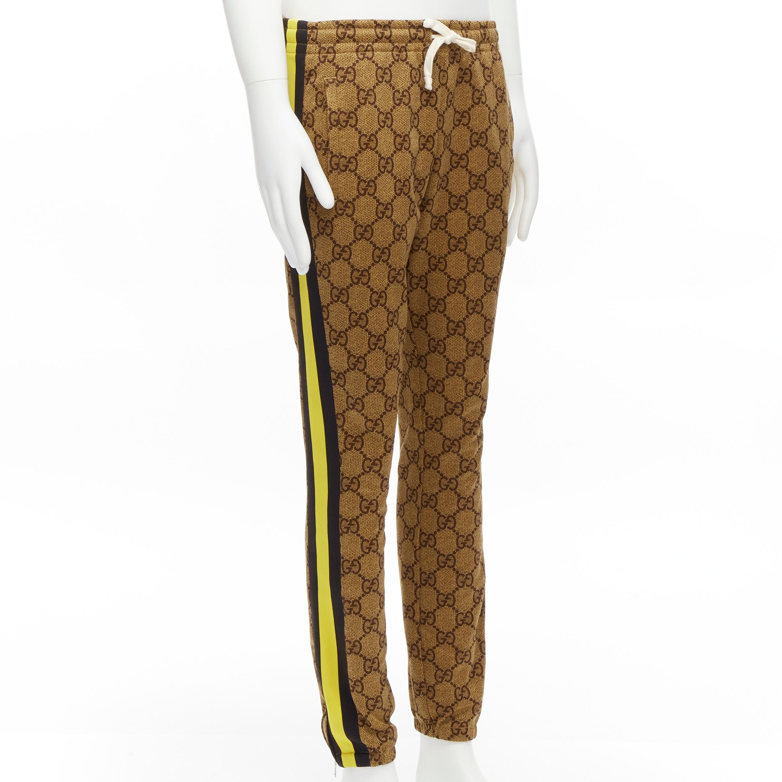 GUCCI Michele 2019 brown GG monogram yellow web trim track pants joggers S
Reference: TGAS/D00089
Brand: Gucci
Designer: Alessandro Michele
Collection: 2019
Material: Polyester, Cotton
Color: Brown, Yellow
Pattern: Monogram
Closure: Drawstring
Extra