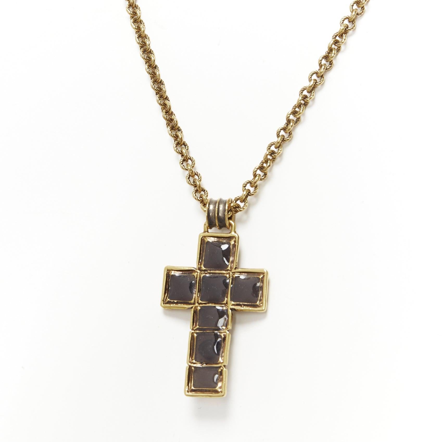 GUCCI Michele black resin Byzantine Cross GG logo charm necklace
Reference: TGAS/D00884
Brand: Gucci
Designer: Alessandro Michele
Material: Metal, Resin
Color: Gold, Black
Pattern: Solid
Closure: Lobster Clasp
Lining: Gold Metal
Extra Details: GG
