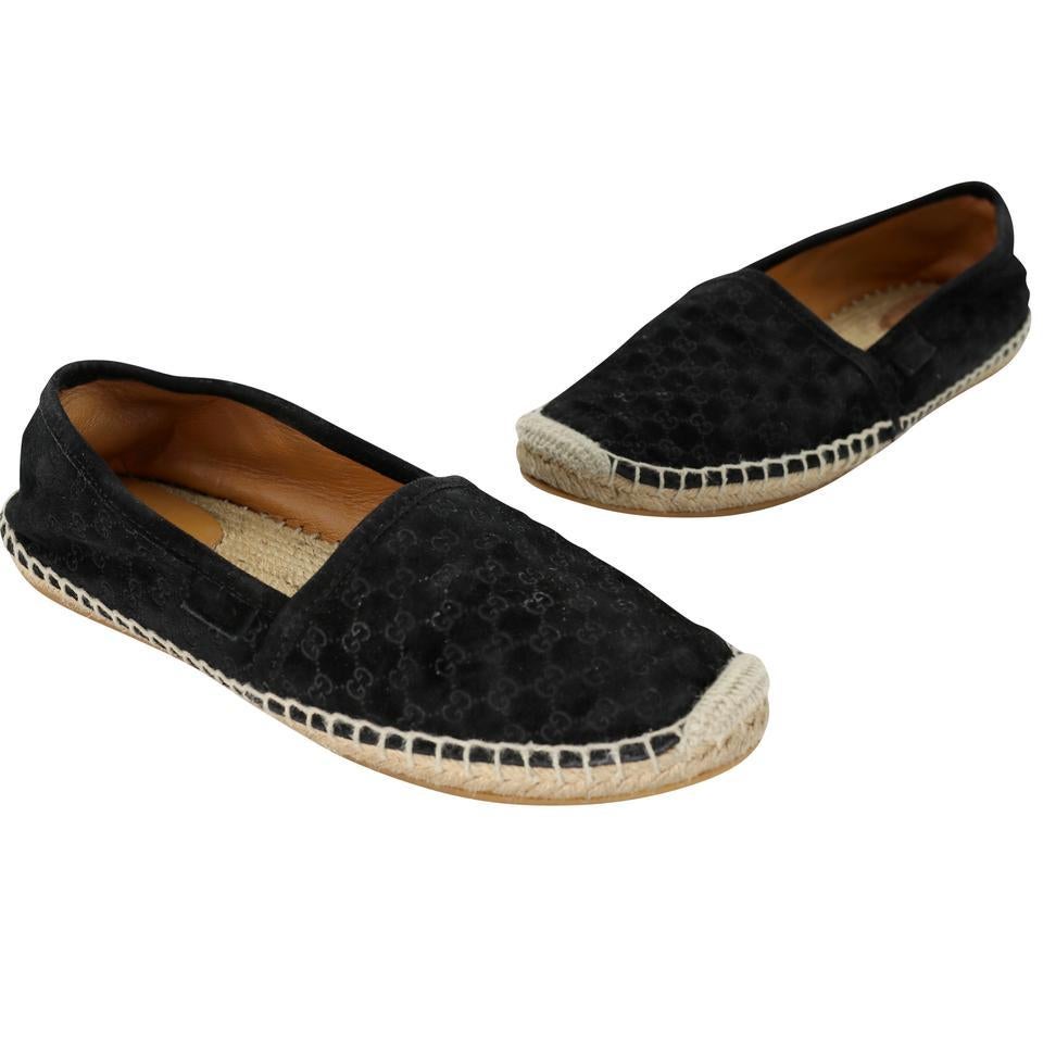These Gucci espadrilles include signature GG micro-embroidered all around the flats with so much detail and beautiful rubber sole. These shoes are in good condition with basic wear some marks on soles of shoe. Leather patch on insole has been