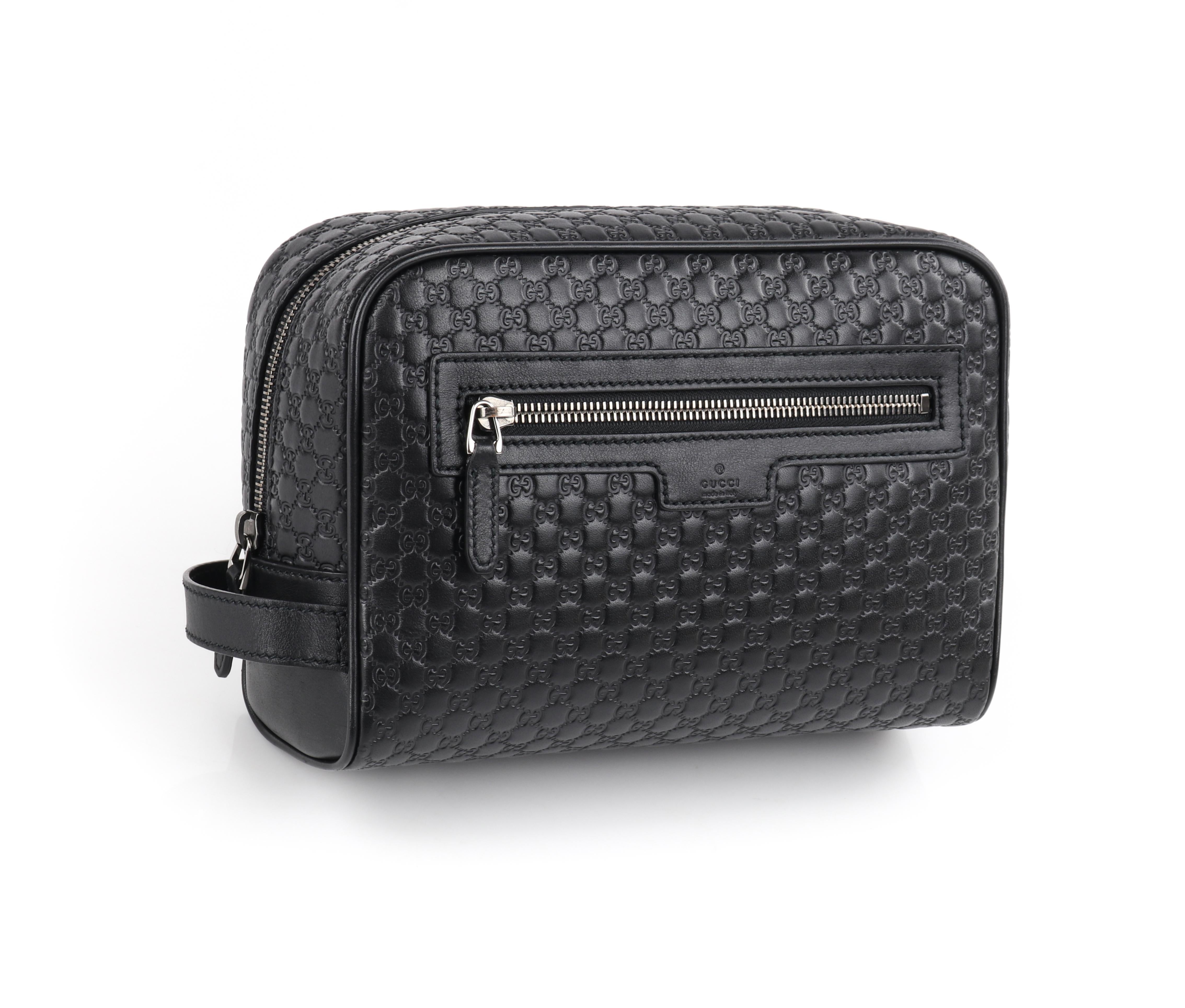 GUCCI “Microguccissima” Black Embossed Leather Zip Cosmetic Toiletry Travel Bag
 
Circa: 2018
Style: Cosmetic toiletry bag
Color(s): Black
Lined: Yes
Unmarked Fabric Content (feel of): Leather (shell); acetate cotton blend (lining); metal (hardware,