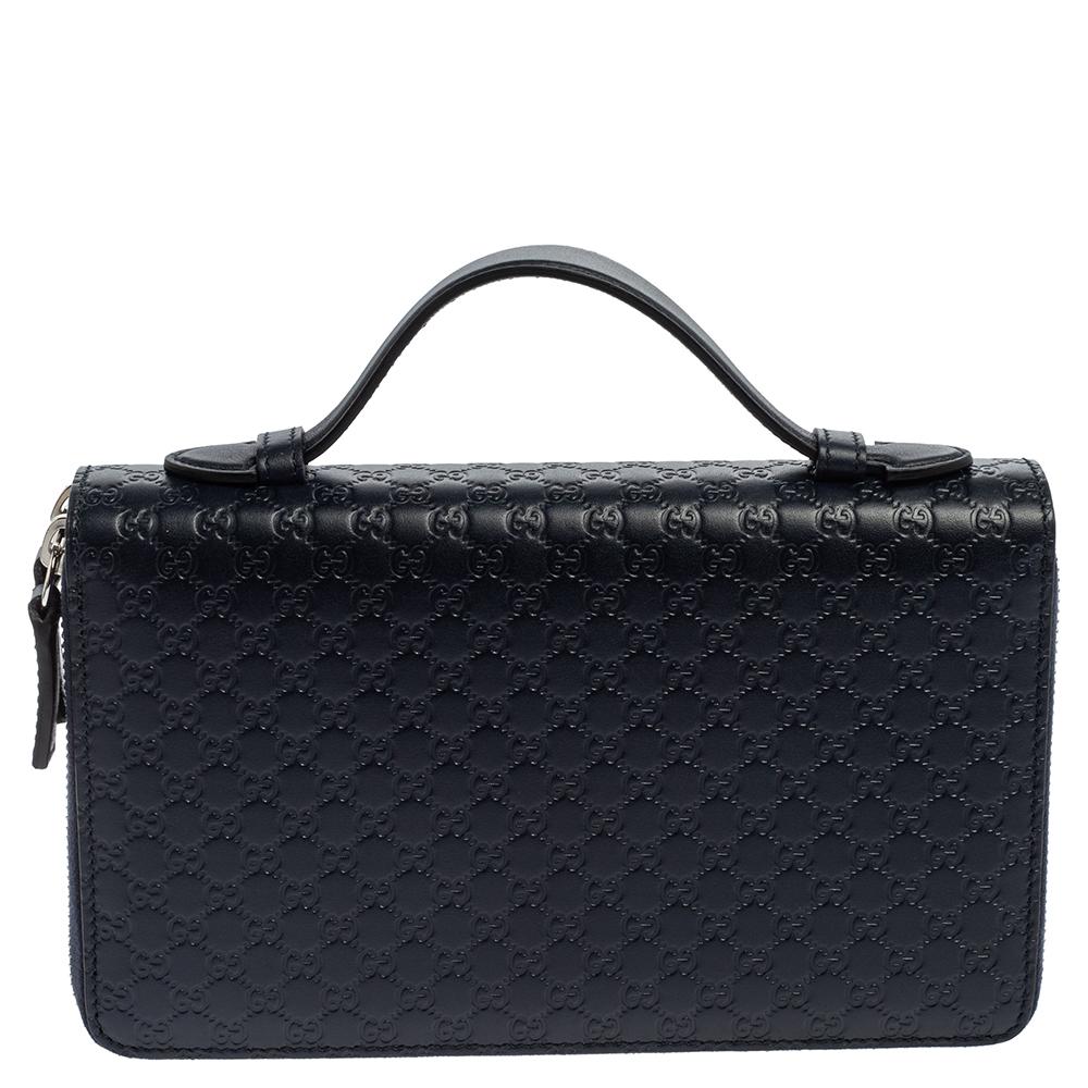 Gucci is known for its trendsetting designs that are functional as well. Crafted from Microguccissima leather, this navy blue organizer has the multiple slots for your essentials. It is sleek and comes with a handle stationed on the