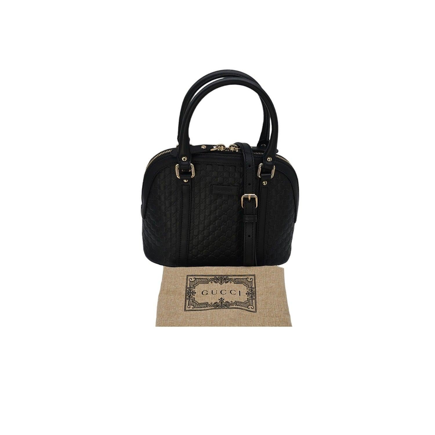 Elevate your look with the exquisite Gucci Microguccissima Mini Dome Bag. Made in Italy, crafted of Gucci Microguccissima black genuine leather with light gold-tone hardware, this bag exudes luxury. The spacious interior and slip pocket make it both