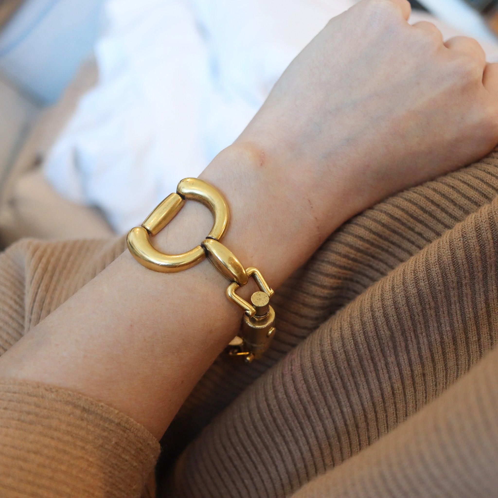Massive horse-bit bracelet designed by Gucci.

This is a rare vintage horse-bit bracelet created in Milano Italy by the fashion and jewelry house of Gucci, back in the 1970. This flexible bracelet is very rare, we have never saw one like this model