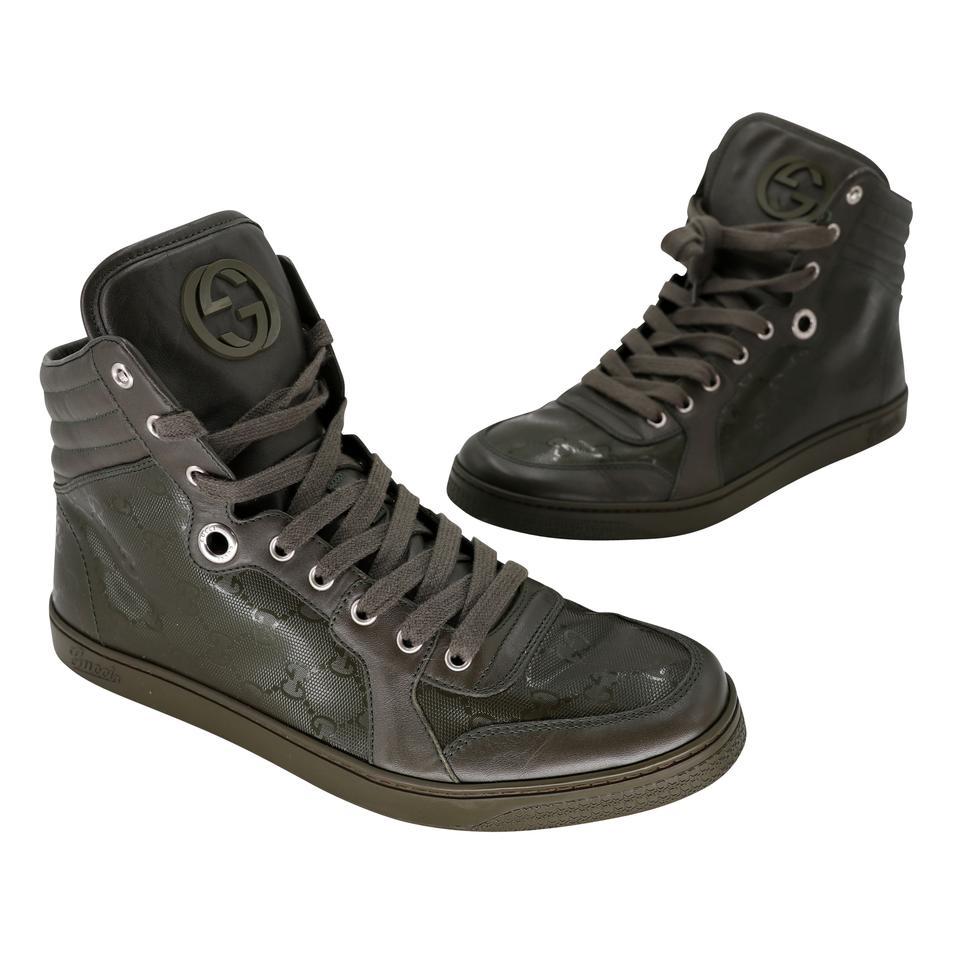 These show-stopping and fun Gucci High Tops can enhance any style. These highly sought after sneakers are a must have for any trendy fashionista! These high tops feature a olive military green padded leather with leather with rubber soles. The soles