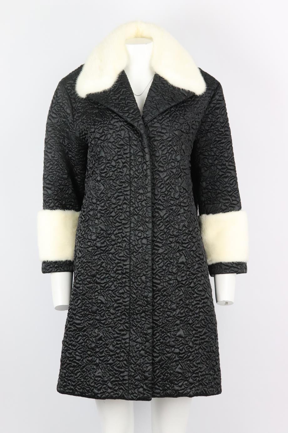 Gucci mink fur trimmed quilted shell coat. Black and white. Long sleeve, v-neck. Zip and snap button fastening at front. 100% Polyamide; fabric2: 96% polyamide, 4% elastane; details: 100% mink fur; filling: 100% polyester; lining: 100% polyamide.