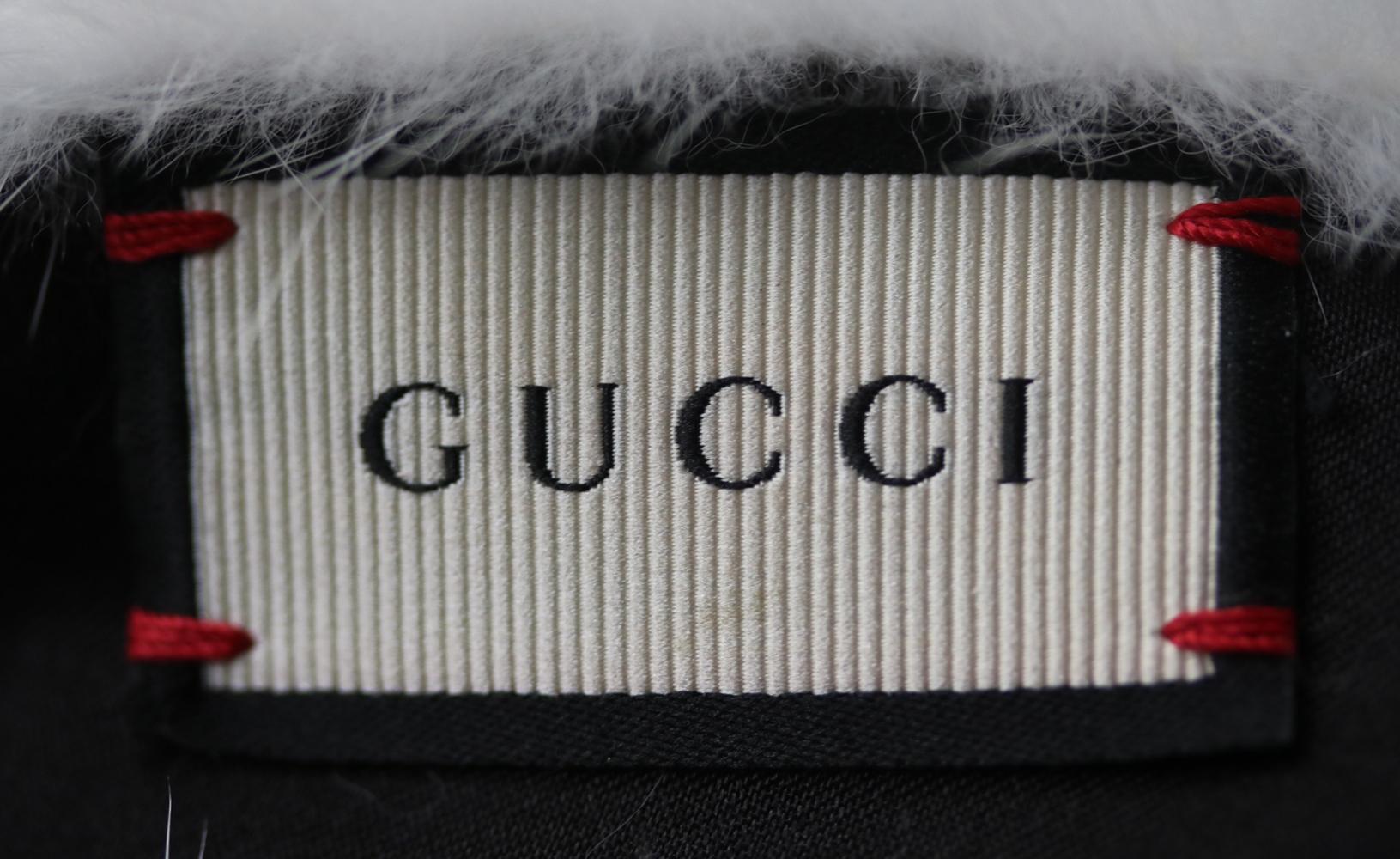 Gucci's white mink-fur twist-front headband is crafted with an elasticated black silk panel for a snug and secure fit. It's crafted in Italy, and will work well with the label's eclectic printed pieces. Snow-white twist-front panels. Gathered