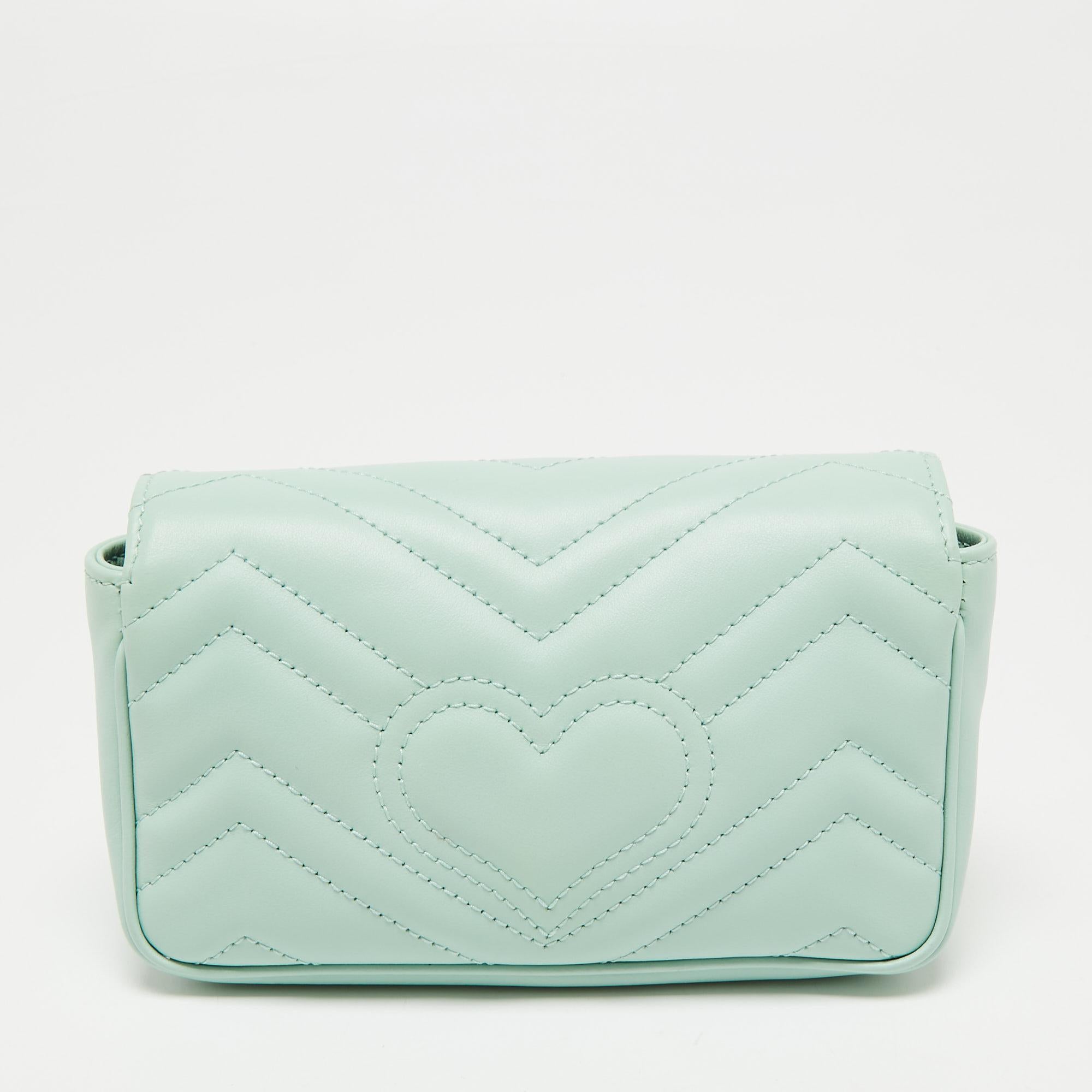This Gucci GG Marmont shoulder bag is a timeless piece to last you season after season. This bag is made of Matelassé leather and will suit all your needs. It has a mint green shade, GG logo detailing, a long shoulder chain, and an Alcantara-lined