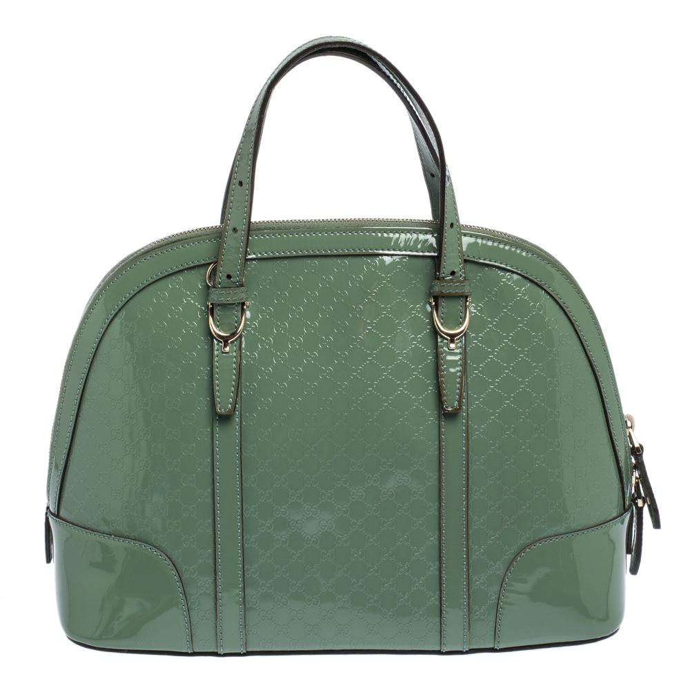Modernize your choice of accessories by adding this Microguccissima patent leather satchel to your collection. Stow all your everyday essentials in the fabric-lined interior of this stunning piece. The eye-catching creation by Gucci is an exemplar