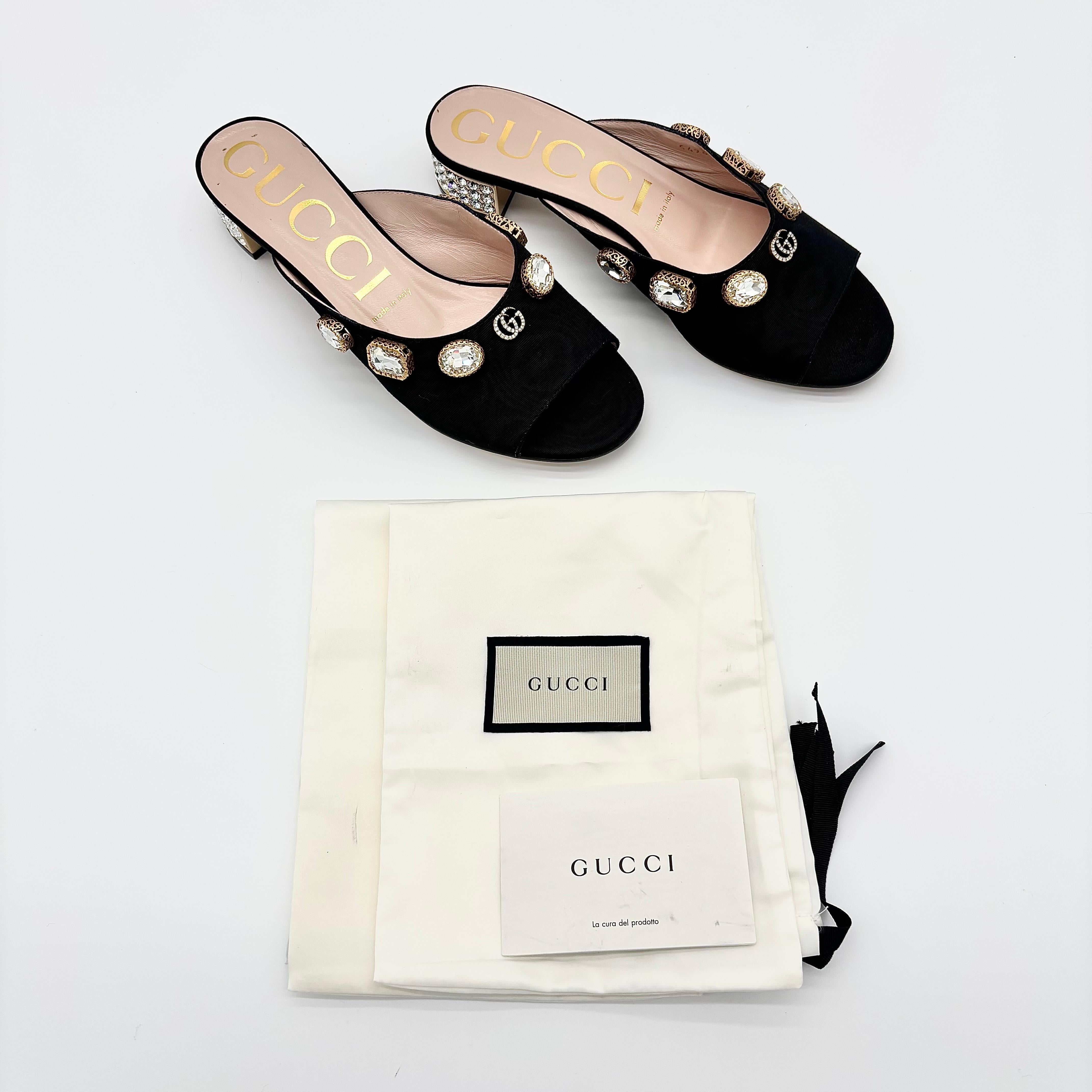 Gucci Moire Lyric Crystal Embellished Mules

Color Black
Size 37.5EU
Satin upper
GG embellishment
Crystal covered platform heel 
Low profile
Slip on style
1.5in heel
Made in Italy

Includes dustbags
Signs of normal use, good overall condition