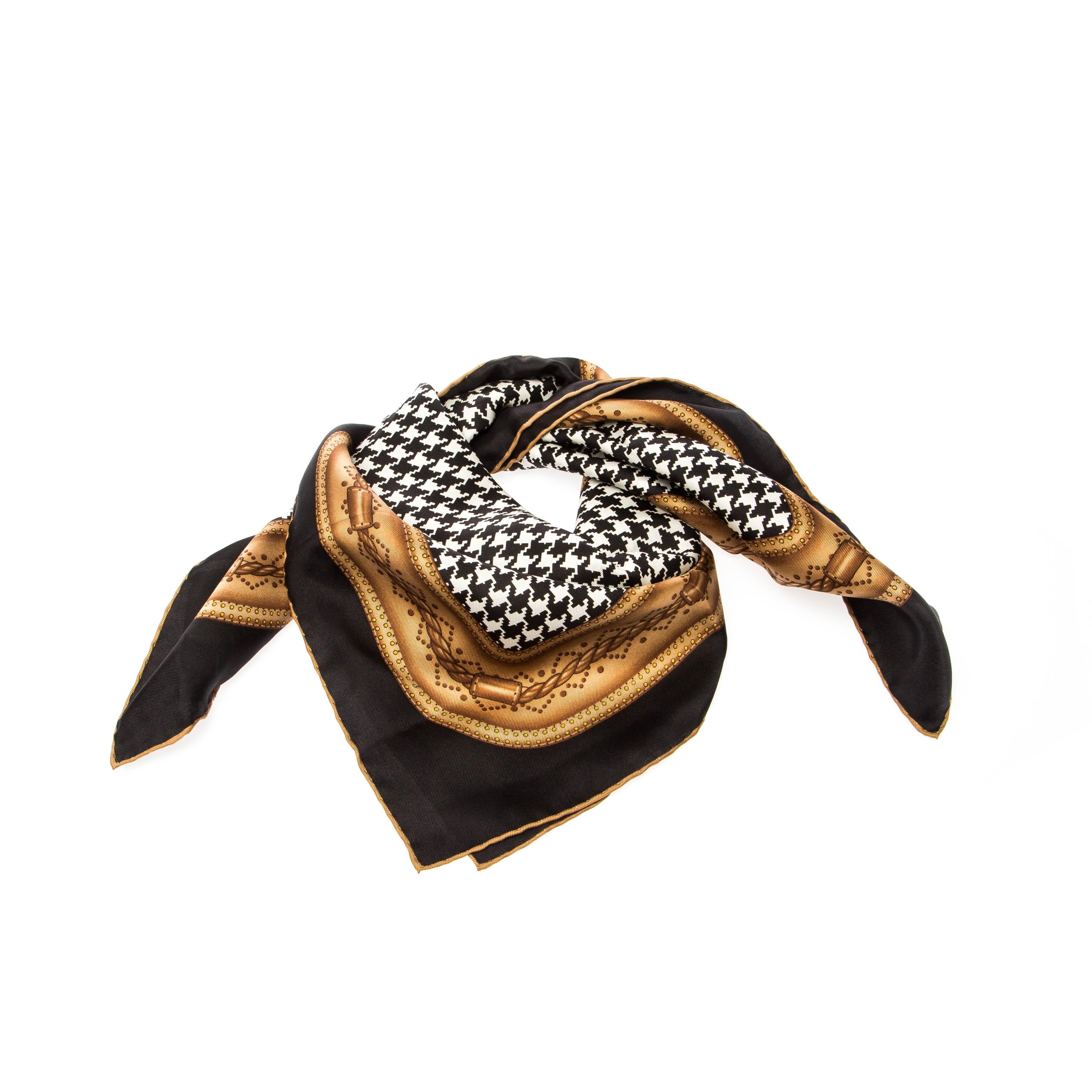 Add an elegant element to your chic style with this silk scarf from Gucci! The piece has been cut from silk and designed with a houndstooth print in a monochrome style and hemmed edges.

Includes: The Luxury Closet Packaging


