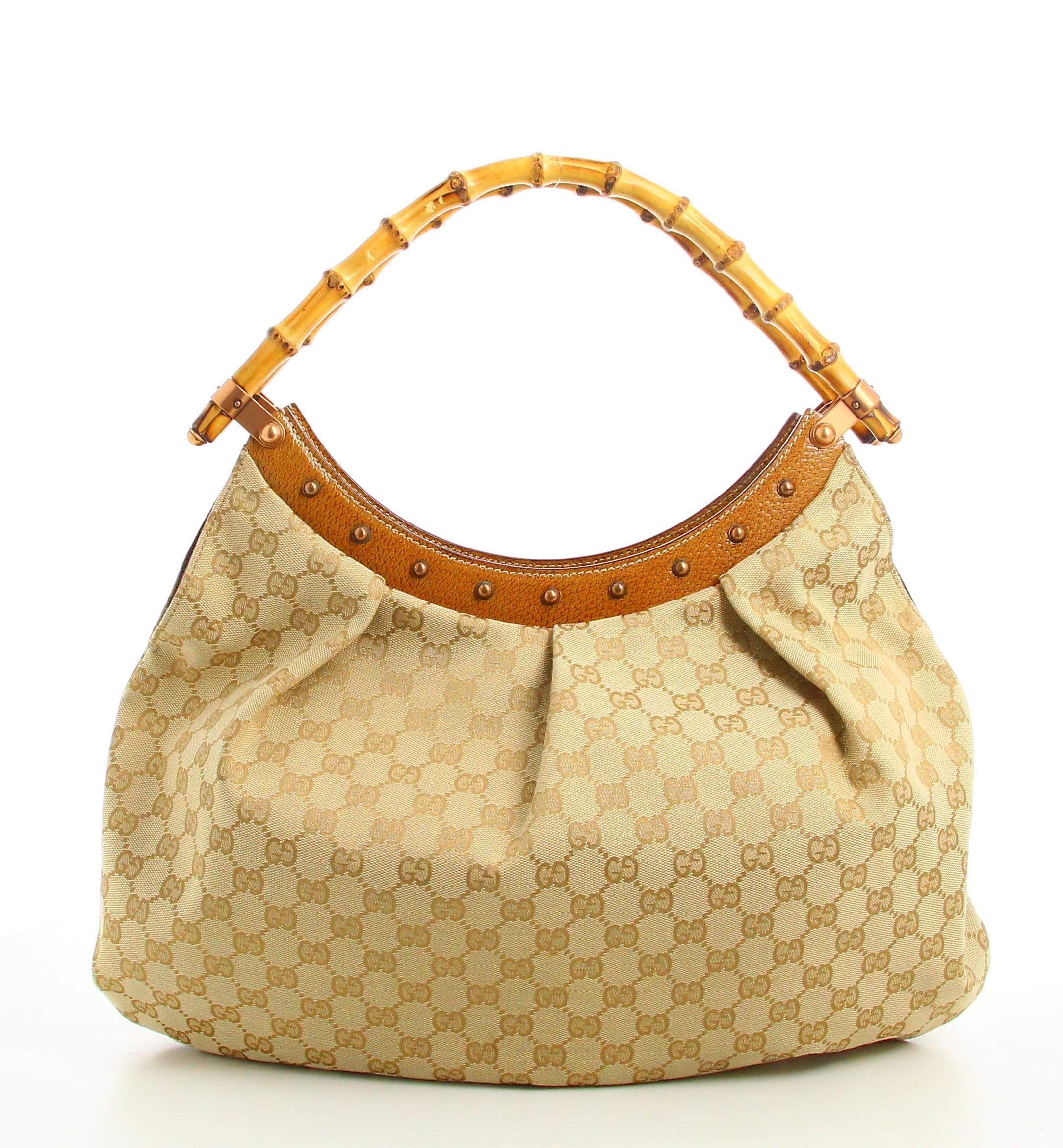 Gucci Monogram Beige Handbag 

- Very good condition. Shows very slight signs of wear over time.
- Gucci Handbag 
- Bamboo handle
- Beige monogram fabric 
- Inside: brown lining plus inside pocket