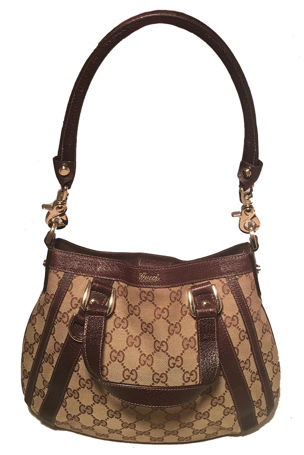 Gucci Monogram Canvas and Brown Leather Small Shoulder Handbag in excellent condition. Signature monogram gucci canvas trimmed with dark brown leather and gold hardware. Double top leather handles and a removable matching leather short shoulder