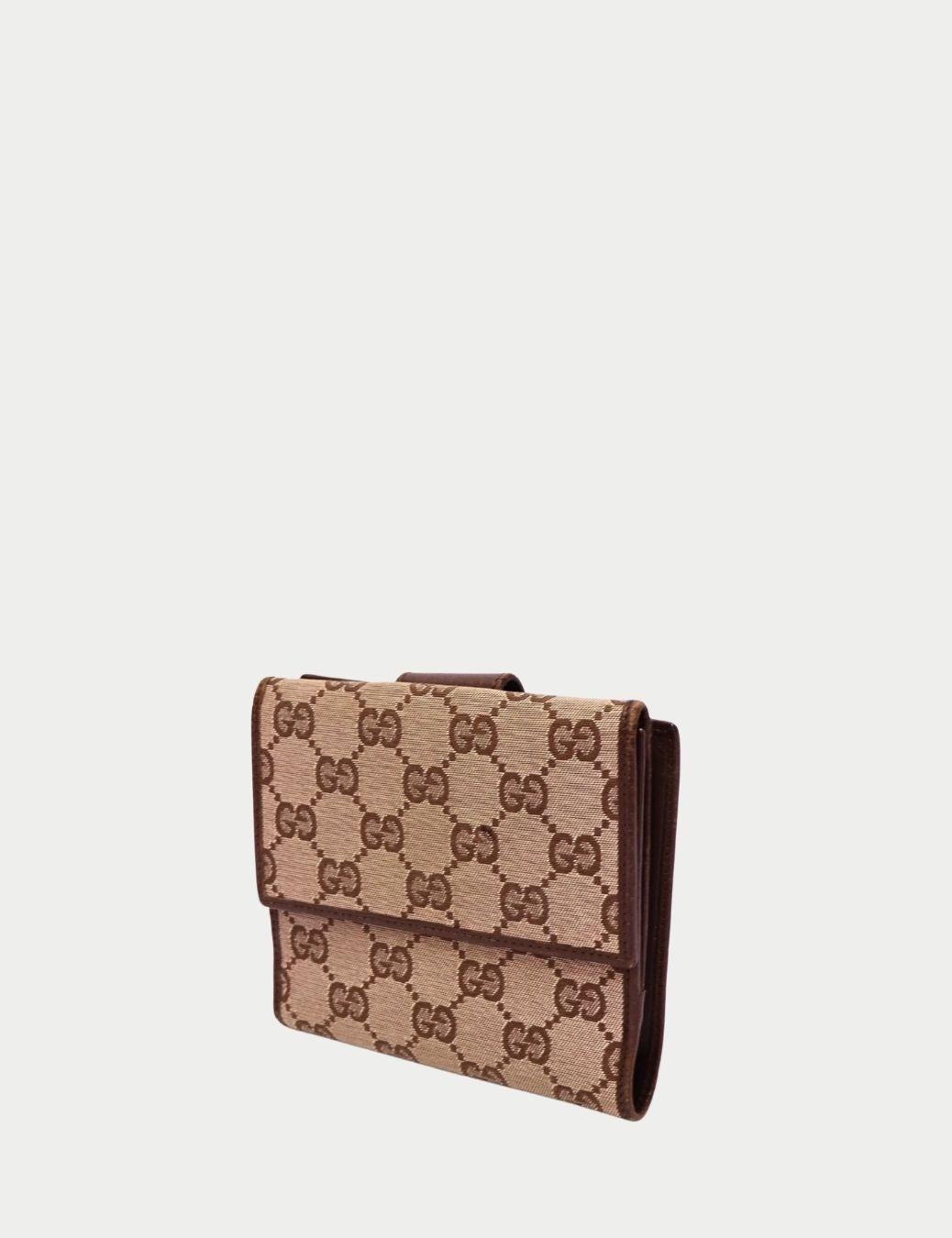 Marrone Portafoglio Gucci Monogram in tela marrone in vendita