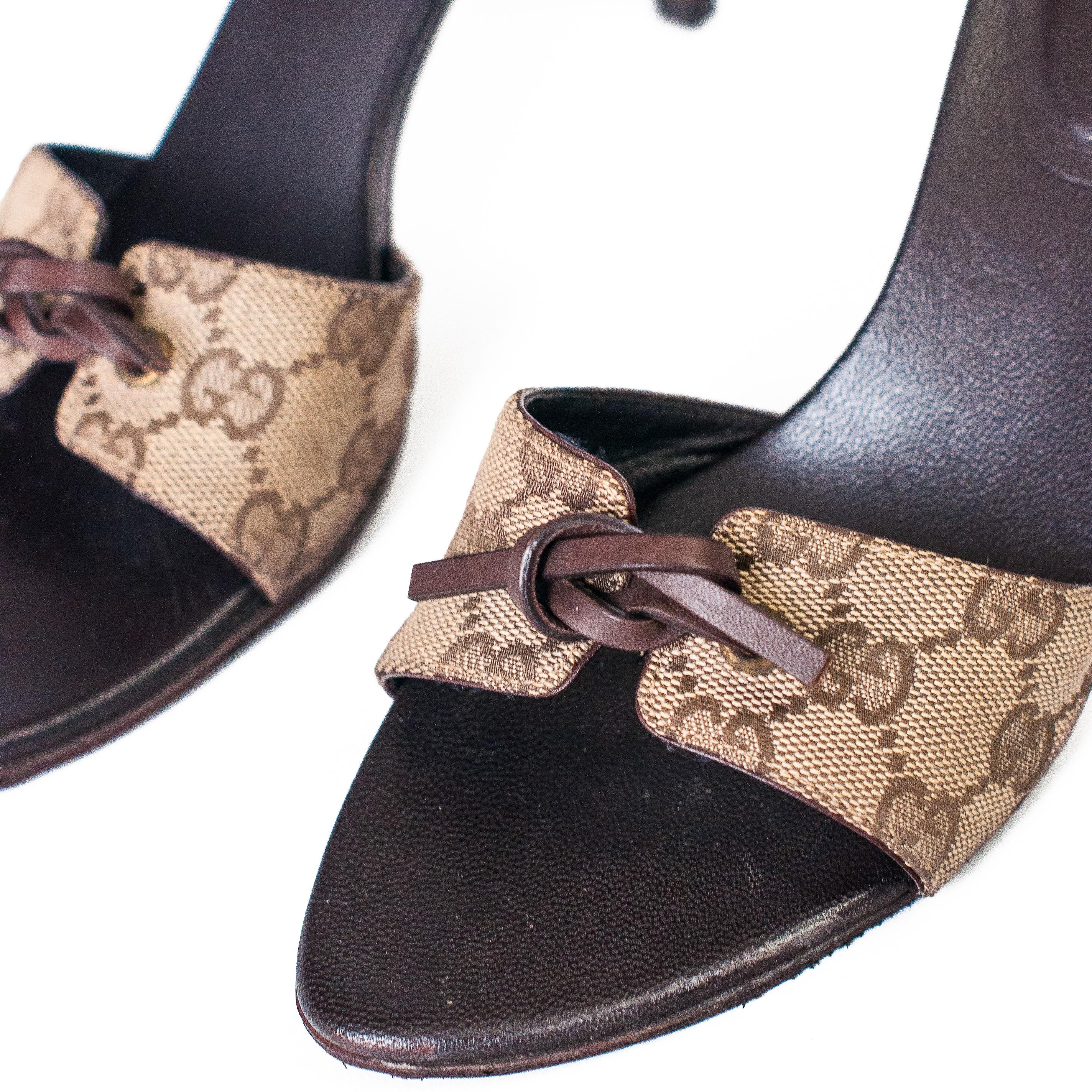 Ruder Than The Rest presents: An elegant pair of Gucci canvas and leather high heel mules.

Gucci monogram canvas front strap with leather tie.

Leather sole.

Made in Italy.

Authenticity guaranteed.

Condition: Excellent, very few signs of wear