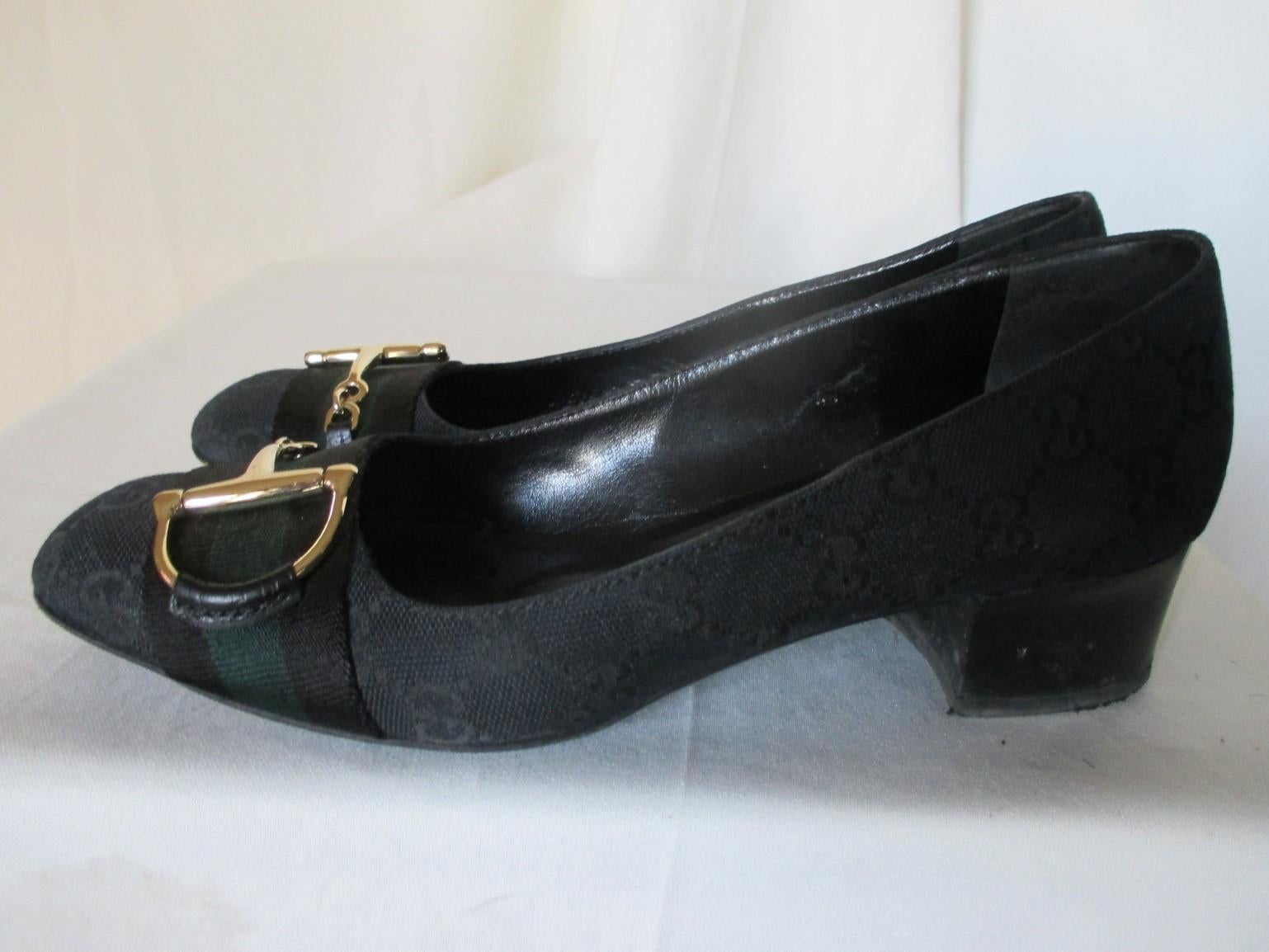 These vintage shoes are monogram canvas printed black/green with horsebits.

We offer more exclusive vintage items, view our frontstore

Details:
They are finished with leather lining.
The heel is aprox. 4 cm/ 1.57 inch high
In good pre-loved