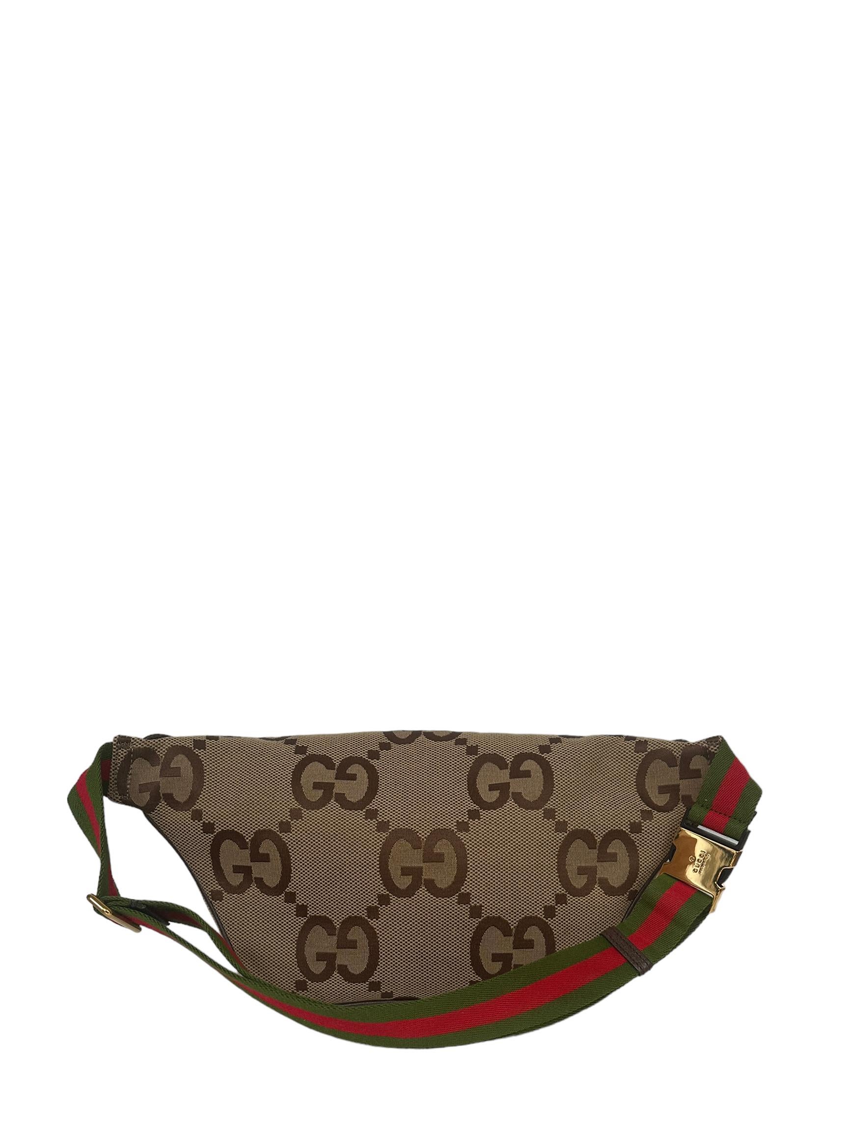 Gucci Monogram Jumbo GG Belt Bag

Made In: Italy
Color: Grown, red, green
Hardware: Goldtone
Materials: Canvas with leather trim
Lining: Beige fine textile
Closure/Opening: Zip
Exterior Pockets: N/A
Interior Pockets: None
Exterior Condition: