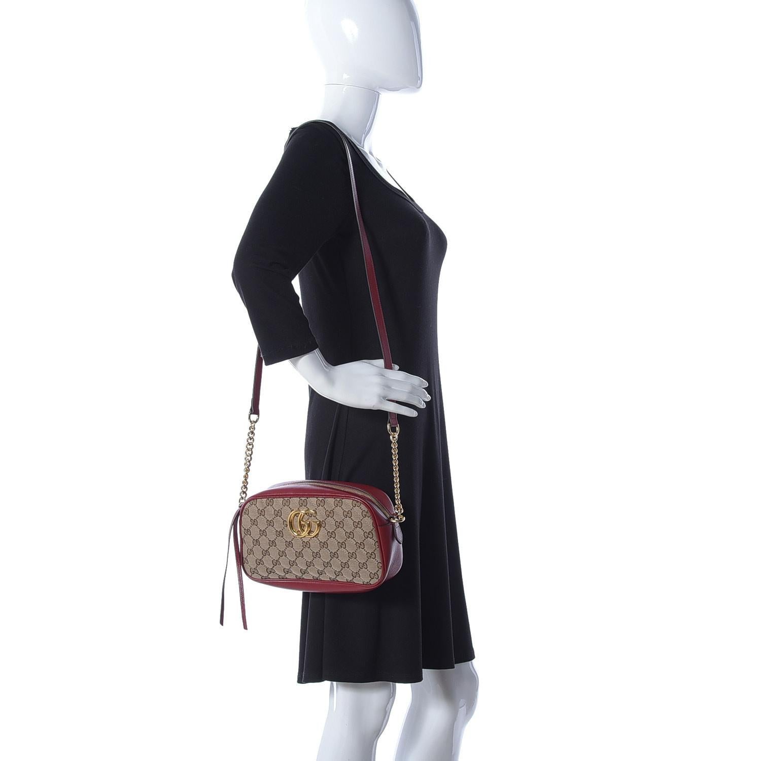 GUCCI MONOGRAM SMALL GG MARMONT SHOULDER BAG BEIGE RED

This shoulder bag is constructed with gucci's original GG canvas with a quilted diagonal matelassé technique and trimmed with black leather. The bag features gold-toned hardware, a chain-link