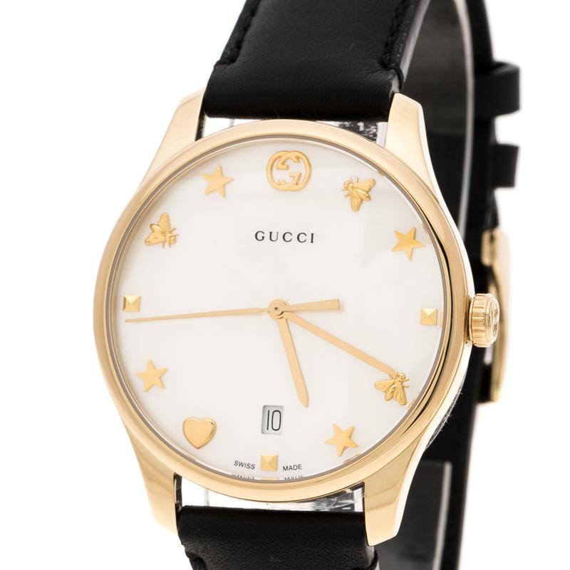 A perfect piece of accessory to pair with both your daytime casuals as well as smarter and chic looks, this Gucci G-Timeless wristwatch is a must have for women with classic taste. This watch features a white mother of pearl dial with alternate bee,
