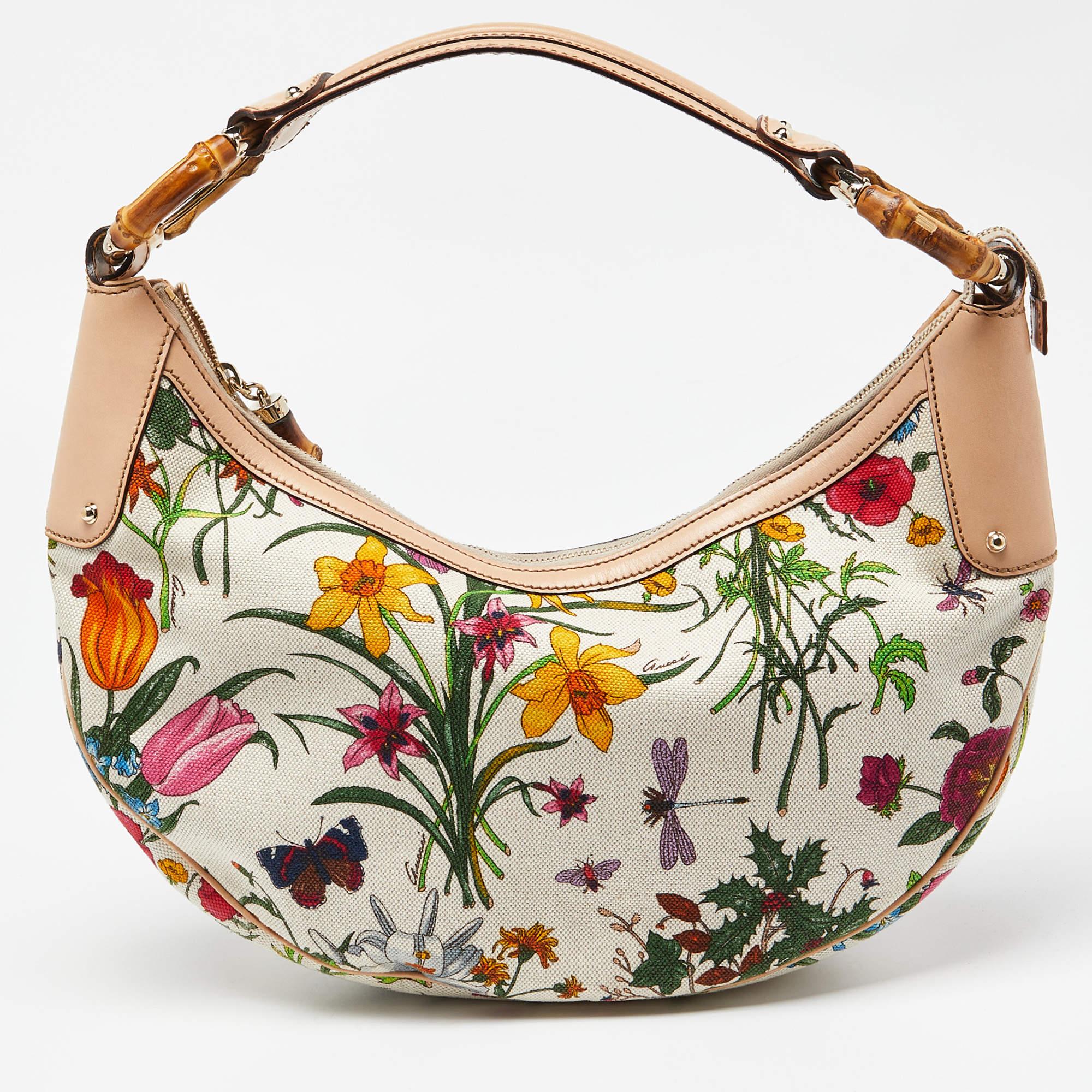 Created to look nothing but flawless, this Gucci hobo is a dream you can add to your collection! Fabulous in a multicolor botanical floral design, it comes crafted from canvas and leather and features a single top handle that is anchored by the
