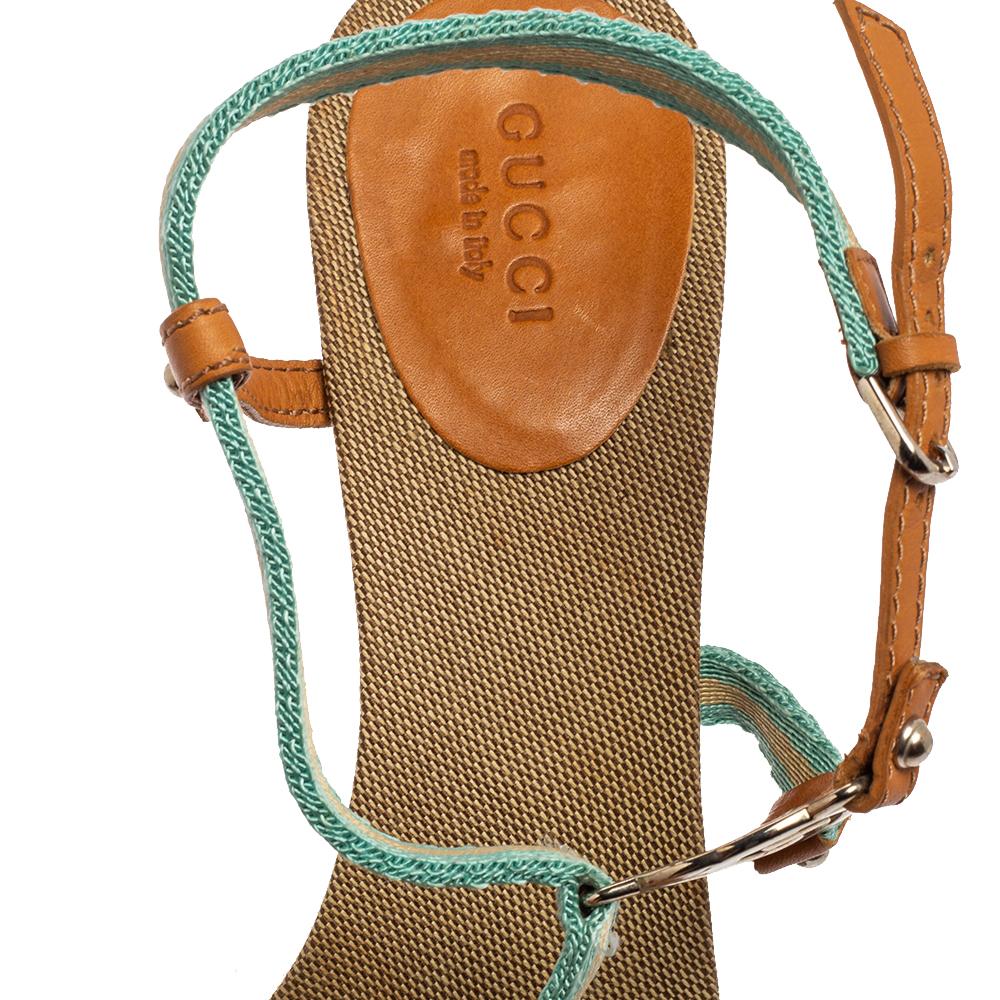 These gorgeous sandals from Gucci are beautifully crafted from canvas and leather. They feature a strappy design and are accented with the GG logo. They come with adjustable ankle straps and 10 cm heels. The insoles are lined with canvas for