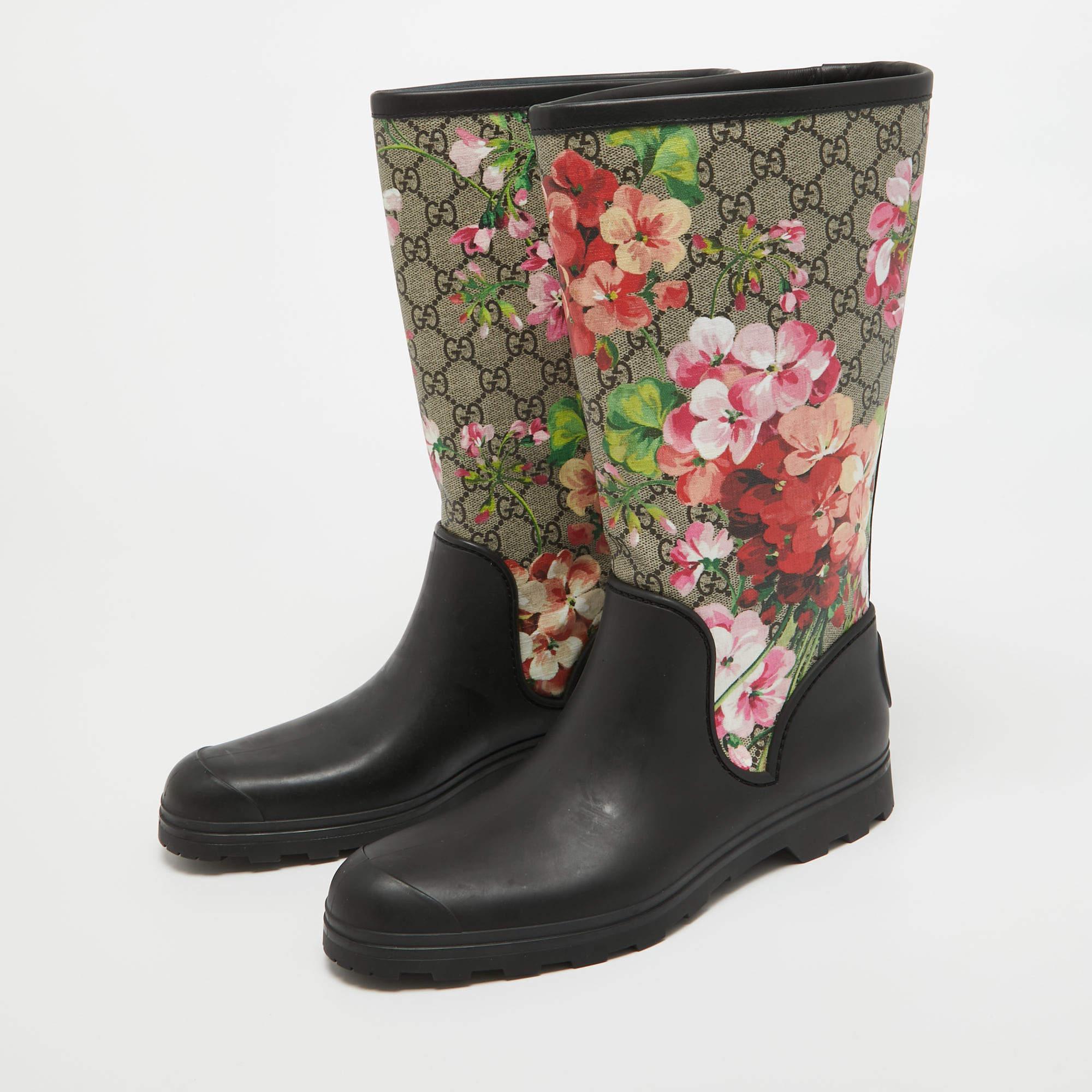 Experience the whimsical charm of Gucci's boots. Crafted with meticulous attention to detail, these boots boast a vibrant floral motif on canvas, juxtaposed with durable rubber soles for practicality. Perfect for adding a pop of color to your