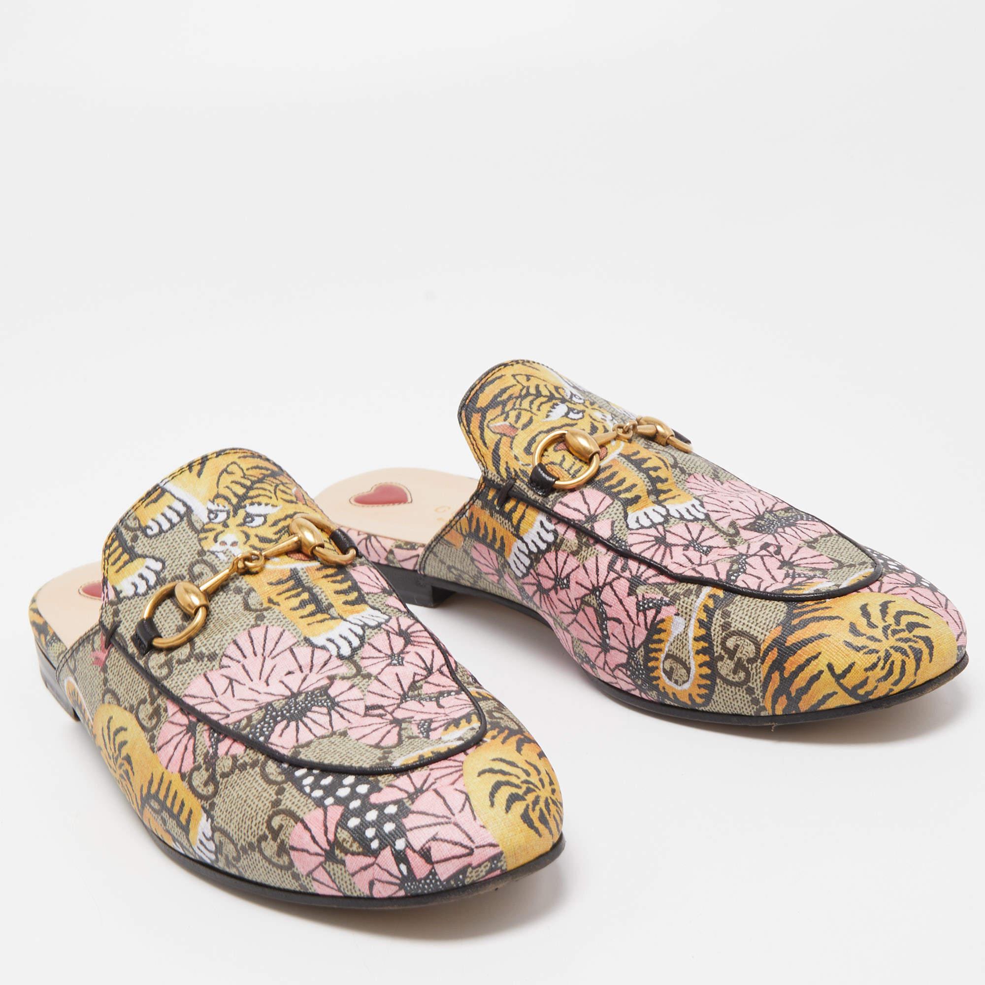 A contemporary portrayal of the Horsebit loafers, these Princetown mules have become one of the most trending styles from Gucci. They are beautifully crafted in GG canvas with the signature Horsebit detail in gold-tone hardware accented on the vamps