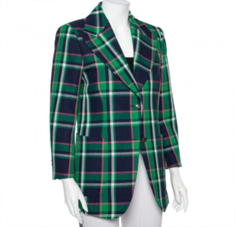 With such a chic and smart blazer, you are sure to make a statement! This multicolor Gucci creation is made of wool and designed with a checkered pattern all over. It flaunts peak lapels, front button fastenings, an embroidered tiger, bow, and