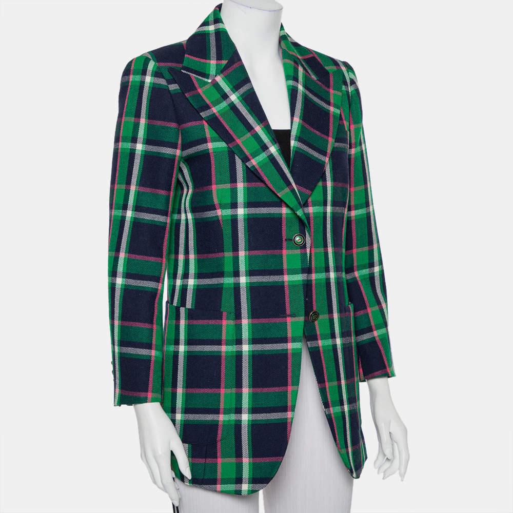 With such a chic and smart blazer, you are sure to make a statement! This multicolor Gucci creation is made of wool and designed with a checkered pattern all over. It flaunts peak lapels, front button fastenings, an embroidered tiger, bow, and