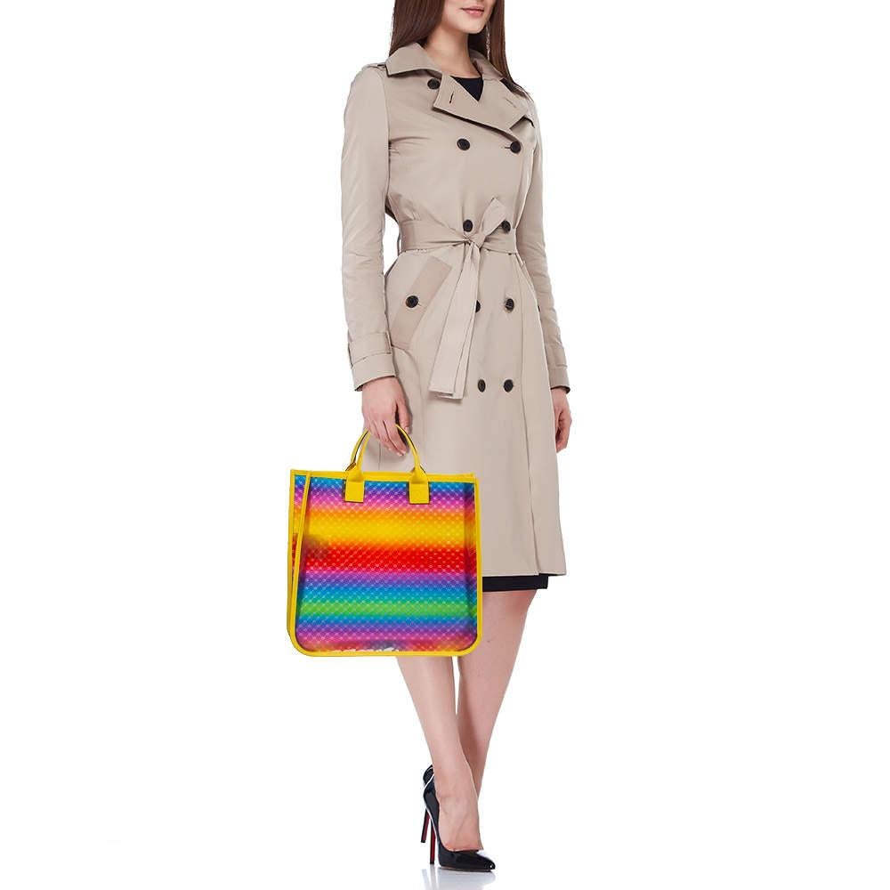 Experience the Gucci tote a fusion of vinyl and leather craftsmanship. Vibrant hues dance across the Diamante pattern creating a dynamic visual feast. With ample space and sturdy handles it seamlessly blends practicality with high fashion allure