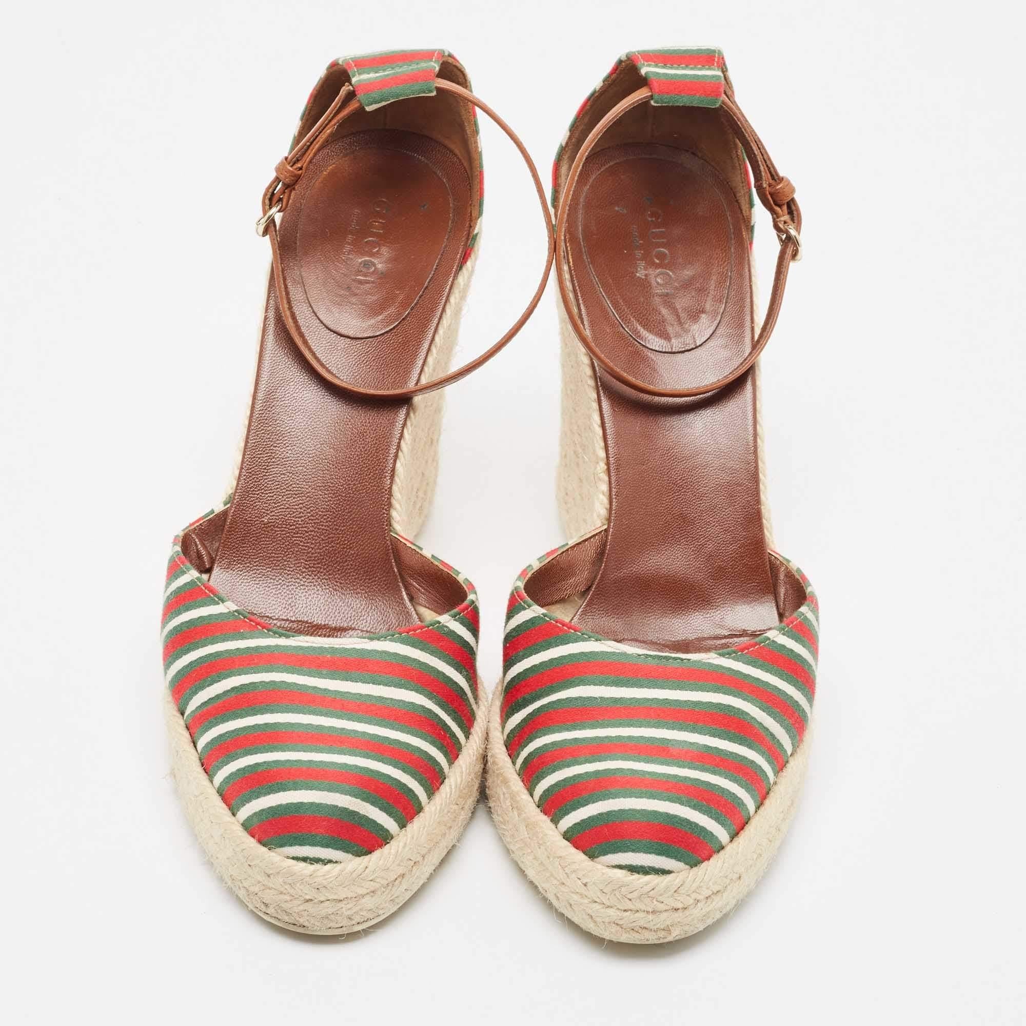 This pair of sandals by Gucci delivers sophistication. The shoes come made from fabric in classy shades and are designed with covered toes, platforms and 11cm wedge heels.

