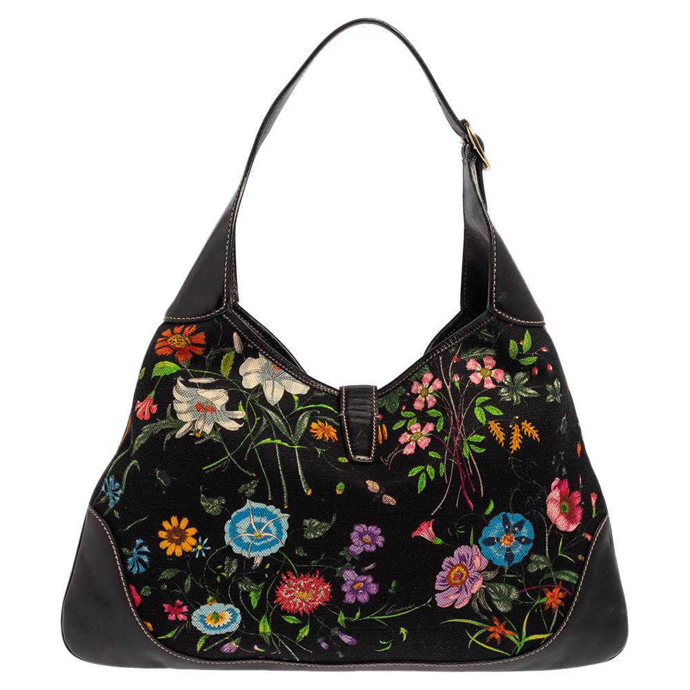 Gucci has always offered cult-favorite bags, just like this Jackie O’ Bouvier hobo created as a homage to Jacqueline Kennedy Onassis. It is crafted from floral-print canvas & leather in multiple hues. A piston push-lock closure opens to a roomy