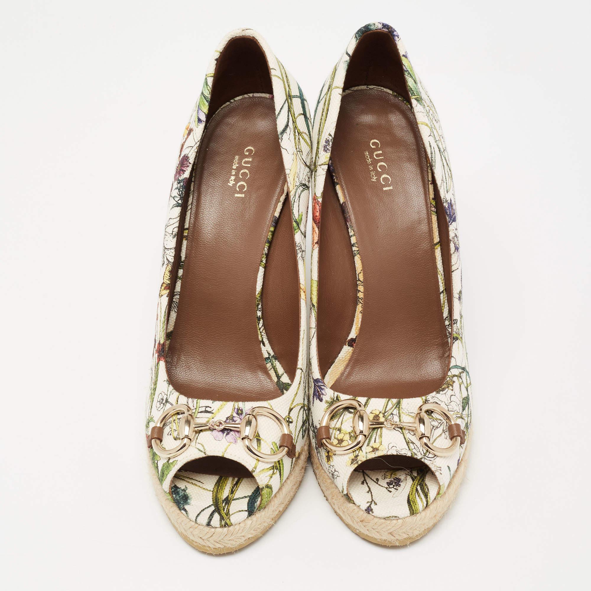 These wedge pumps from Gucci are crafted from canvas in a multicolored, floral print. They feature the signature Horsebit accents on the vamps, smooth insoles, and durable rubber soles for a comfortable walk.

