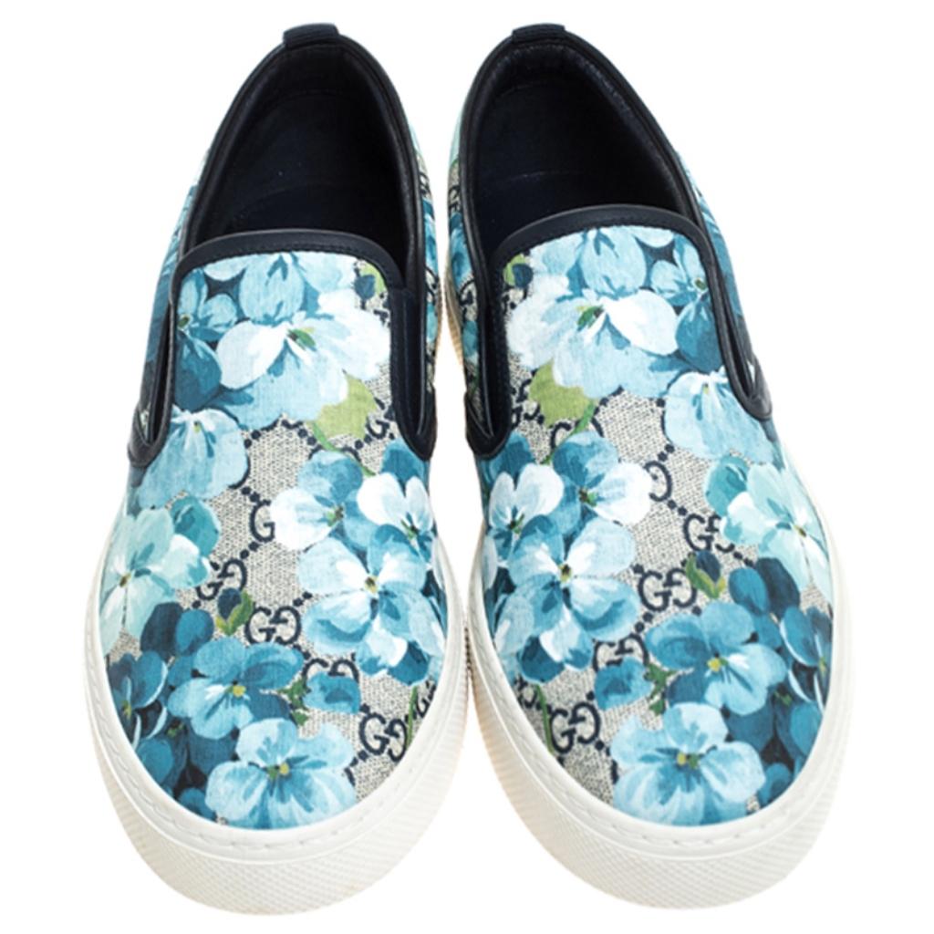 Step out in style this summer with these sneakers from Gucci. Featuring their signature GG Supreme Blooms print on the canvas exterior, this trendy round-toe pair has leather-lined interiors with the brand's iconic label on the insole. Soak up the