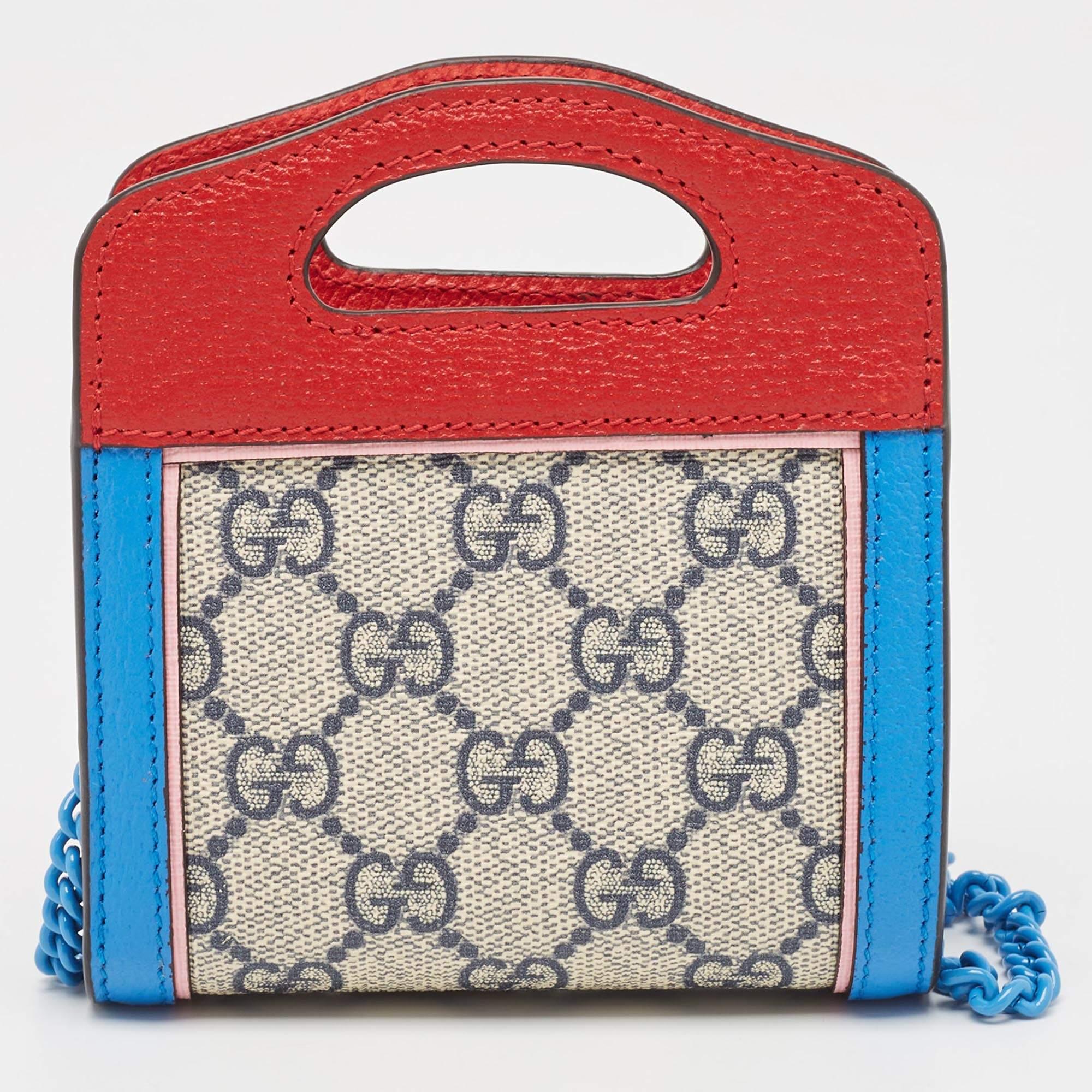 The Gucci wallet on chain exudes sophistication and style. Crafted from premium materials, it features the iconic GG Supreme canvas adorned with a vibrant multicolor pattern, accented with luxurious leather details. Compact yet spacious, it