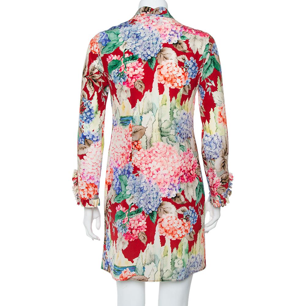 Words fall short to describe this shirt dress from Gucci. It comes in lovely multicolored hues and is designed with a hydrangea print, a simple neckline with tie detailing, and a flattering fit. The comfortable dress cut from silk will look great