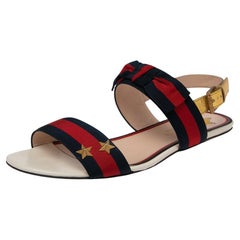 Gucci Mehrfarbige Slingback-Sandalen aus Leder und Segeltuch mit Webbesatz Größe 38
