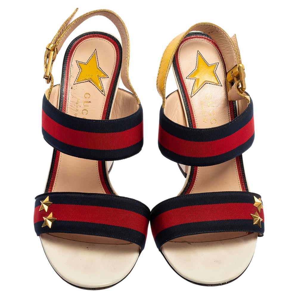 Stacked with emblematic detailing of the House, these sandals from Gucci will adorn your feet with iconic beauty and aesthetics. These sandals are made from multicolored leather and are outlined with Web Stripe trims on the upper straps. Gold-toned