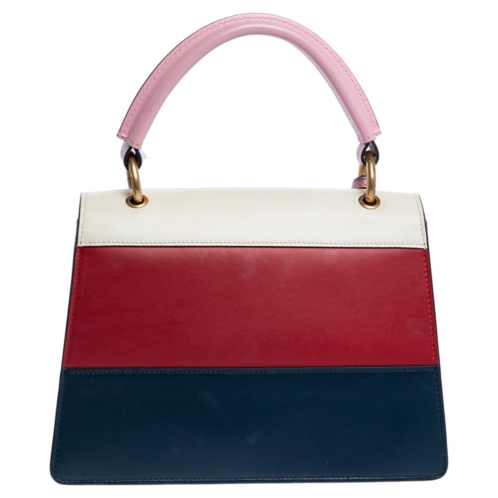 From the house of Gucci, this Queen Margaret bag is an outstanding fusion of brilliance and timeless style. Exhibiting an impressive design, the top handle leather bag has an embellished flap, a top handle and a suede interior.

Includes: Strap,