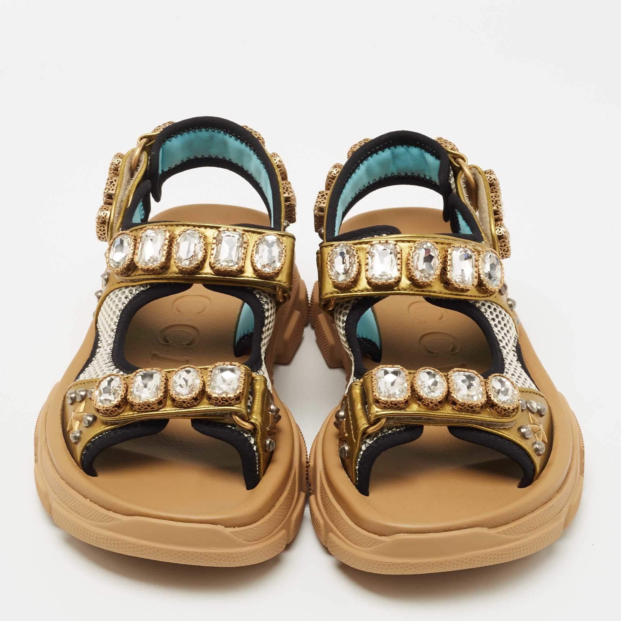 These stylish Gucci Aguru sandals are a perfect blend of comfort and style. Featuring a sturdy exterior made from leather and mesh, these sandals are accented with embellishments all over.
 
Includes: Dustbag
