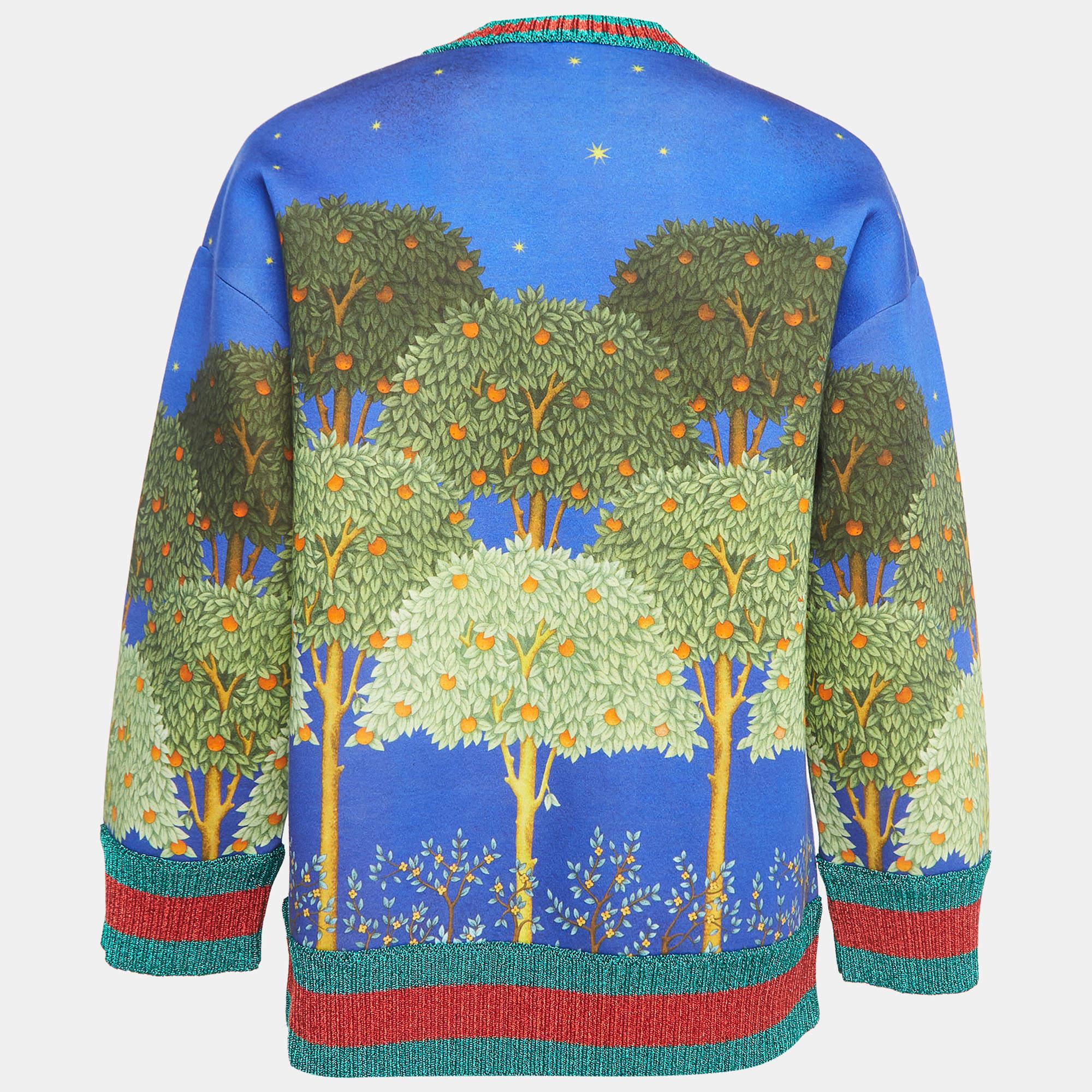 Each of Gucci's creations exhibits signature beauty, elegance, and luxury. This sweater from Gucci will make a luxurious addition to your closet. It is made from cotton fabric, with a multicolored Night Garden print augmenting its silhouette. It has