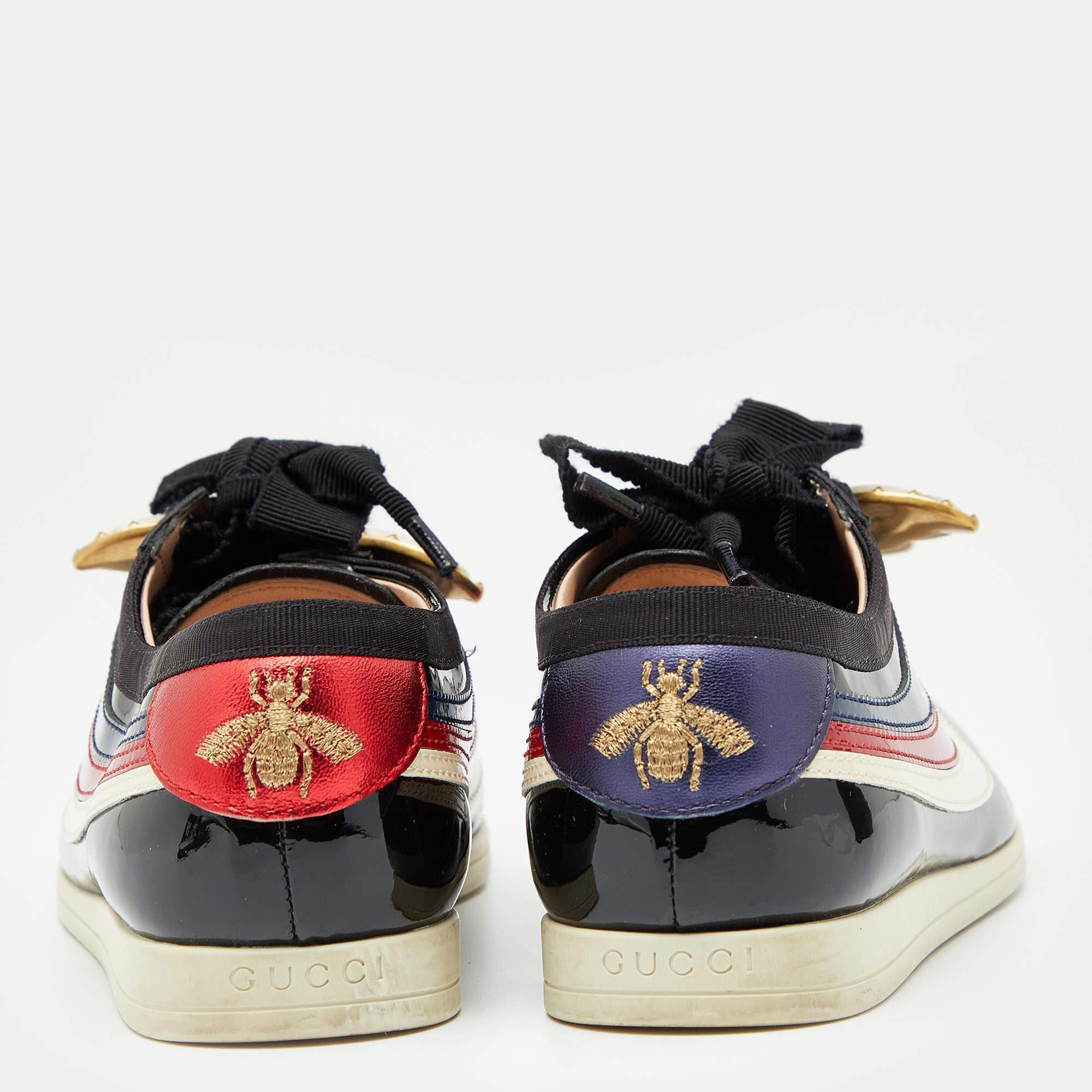 These adorable sneakers are from Gucci. They've been crafted from patent leather and designed as round toes with other details such as lace-ups and butterfly appliques on the uppers. The multicolored sneakers will offer both comfort and style.

