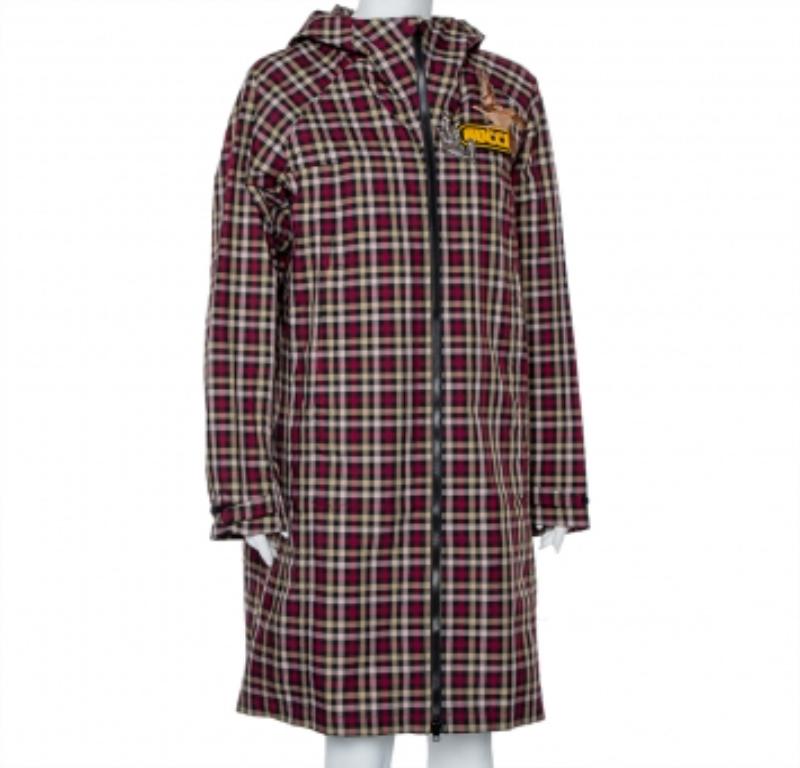 Created using plaid canvas, this Gucci hooded coat for women features a full front zipper, long sleeves, and two pockets. The brand's logo on the chest is joined by a duck and branch detail.