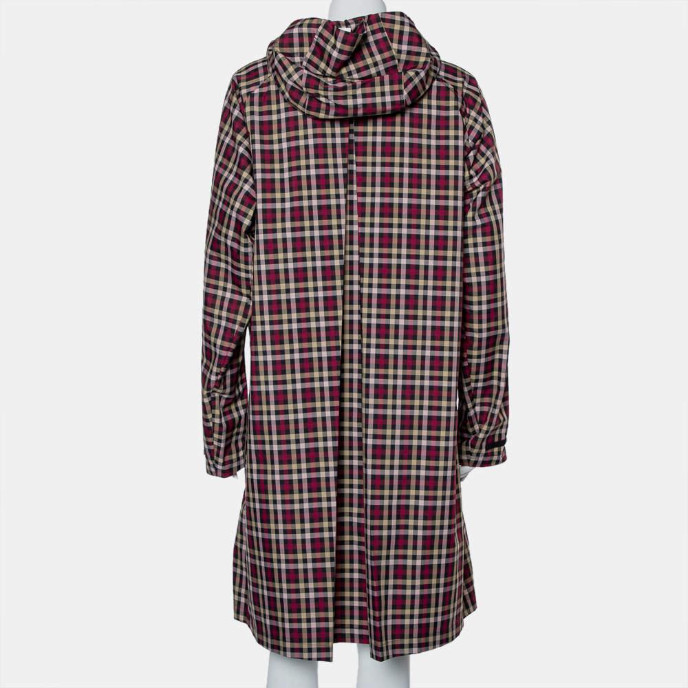 Created using plaid canvas, this Gucci hooded coat for women features a full front zipper, long sleeves, and two pockets. The brand's logo on the chest is joined by a duck and branch detail.

Includes: Brand Tag
