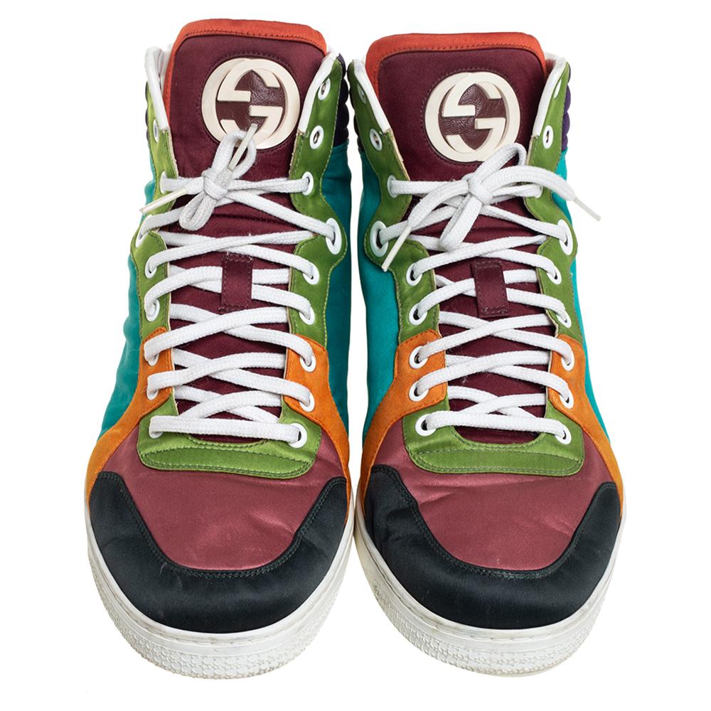 Gucci's sneakers are an example of style and comfort coming together. Crafted from leather in multiple hues, these sneakers flaunt details like the quilted counters, laces, G logos on the tongues, and the raised high top. You wouldn't want to miss