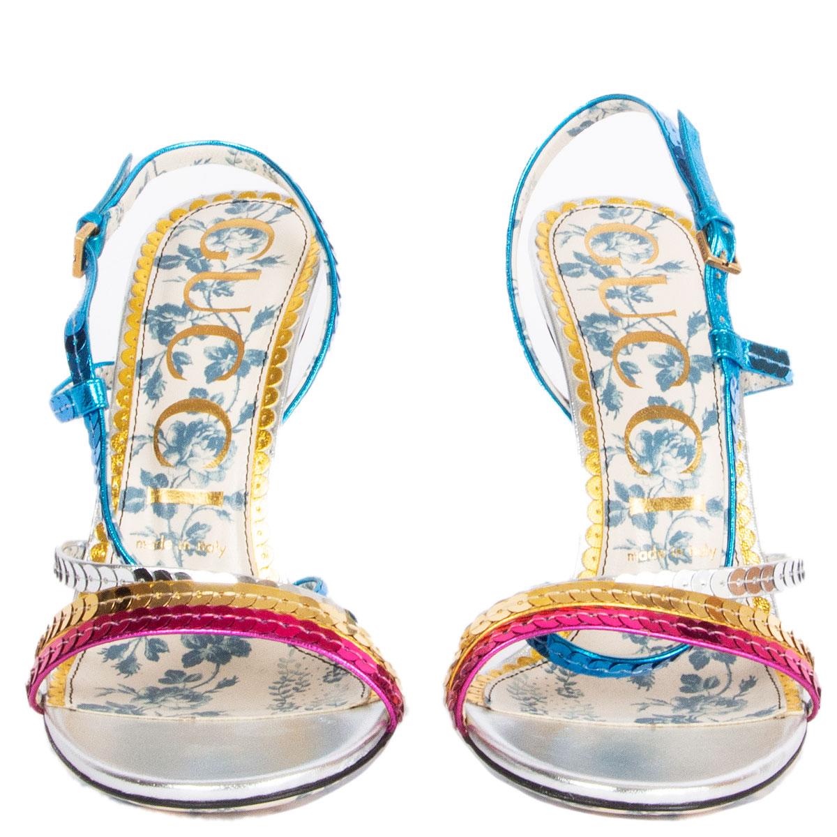100% authentic Gucci Haines 105 sandals in metallic silver leather with pink, gold, silver and blue metallic sequin embellished leather straps. Brand new. 

Imprinted Size 38
Shoe Size 38
Inside Sole 25cm (9.8in)
Width 7.5cm (2.9in)
Heel 11cm