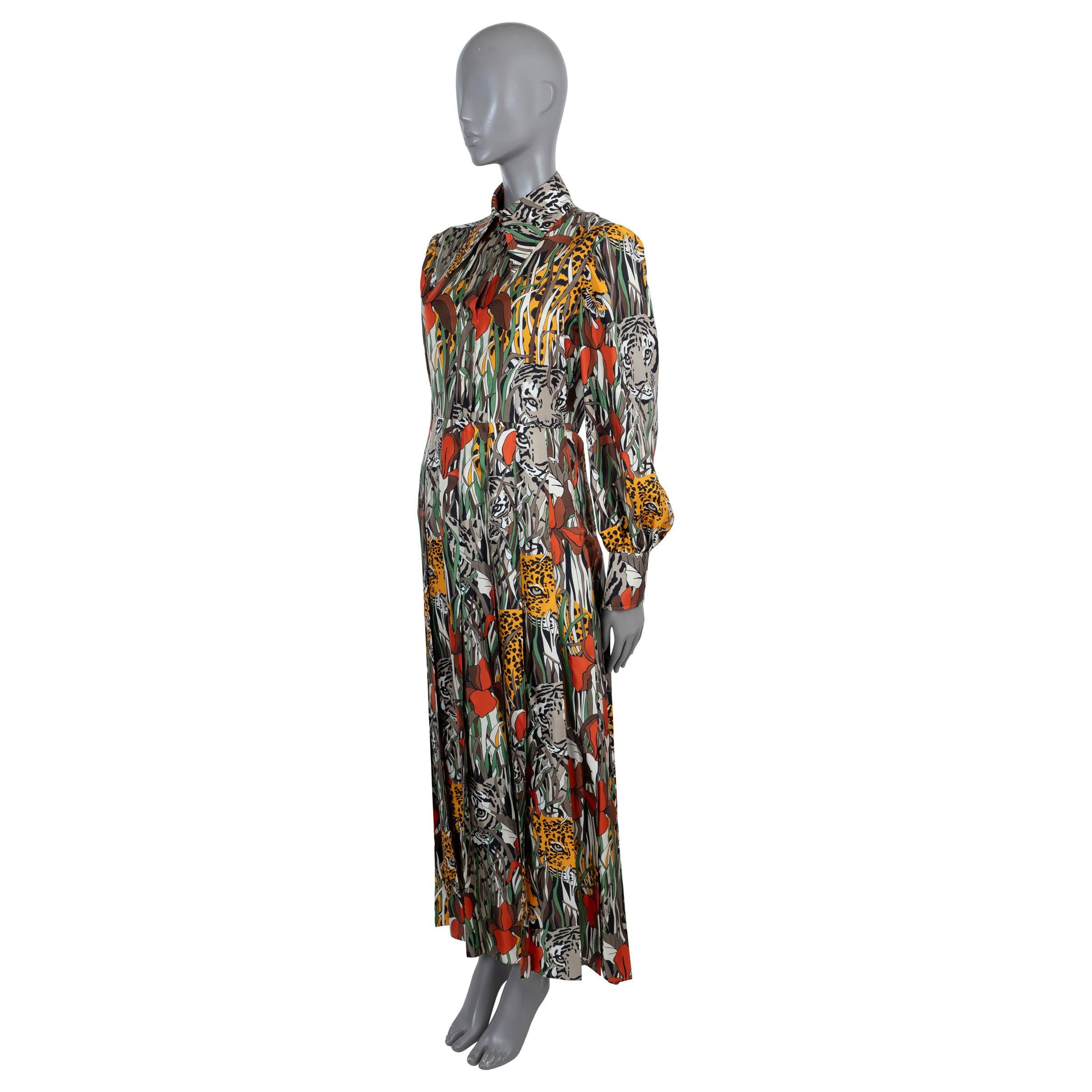 100% authentic Gucci Feline Garden maxi shirt dress in taupe, cream, orange, red and green silk (100%). Features an oversized point collar, cinched waist, pleated skirt and billowing sleeves. Closes with fabric covered buttons on the front and a