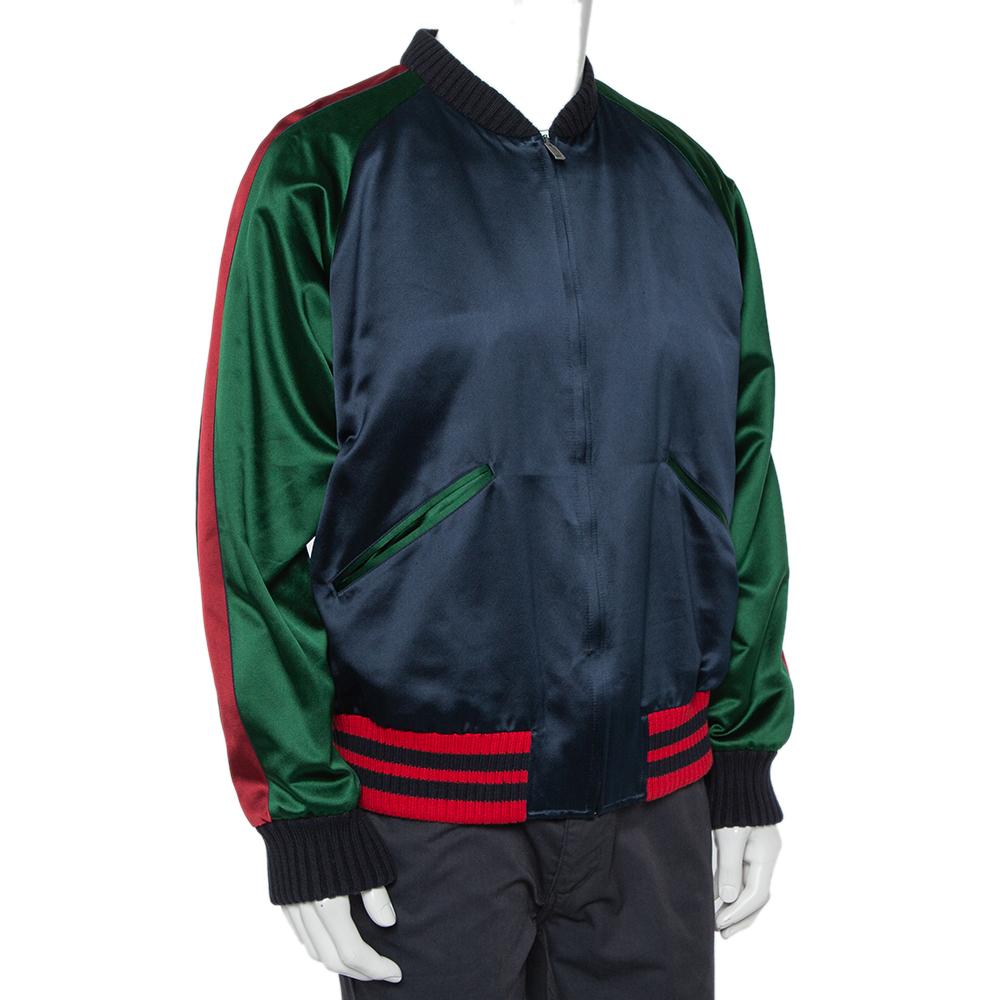 Complete a luxe look by wearing this charming bomber jacket by Gucci. Designed to be a reliable style companion, the men's designer jacket is detailed with ribbed trims, star & panther appliqués on the back, and two pockets. The long-sleeved
