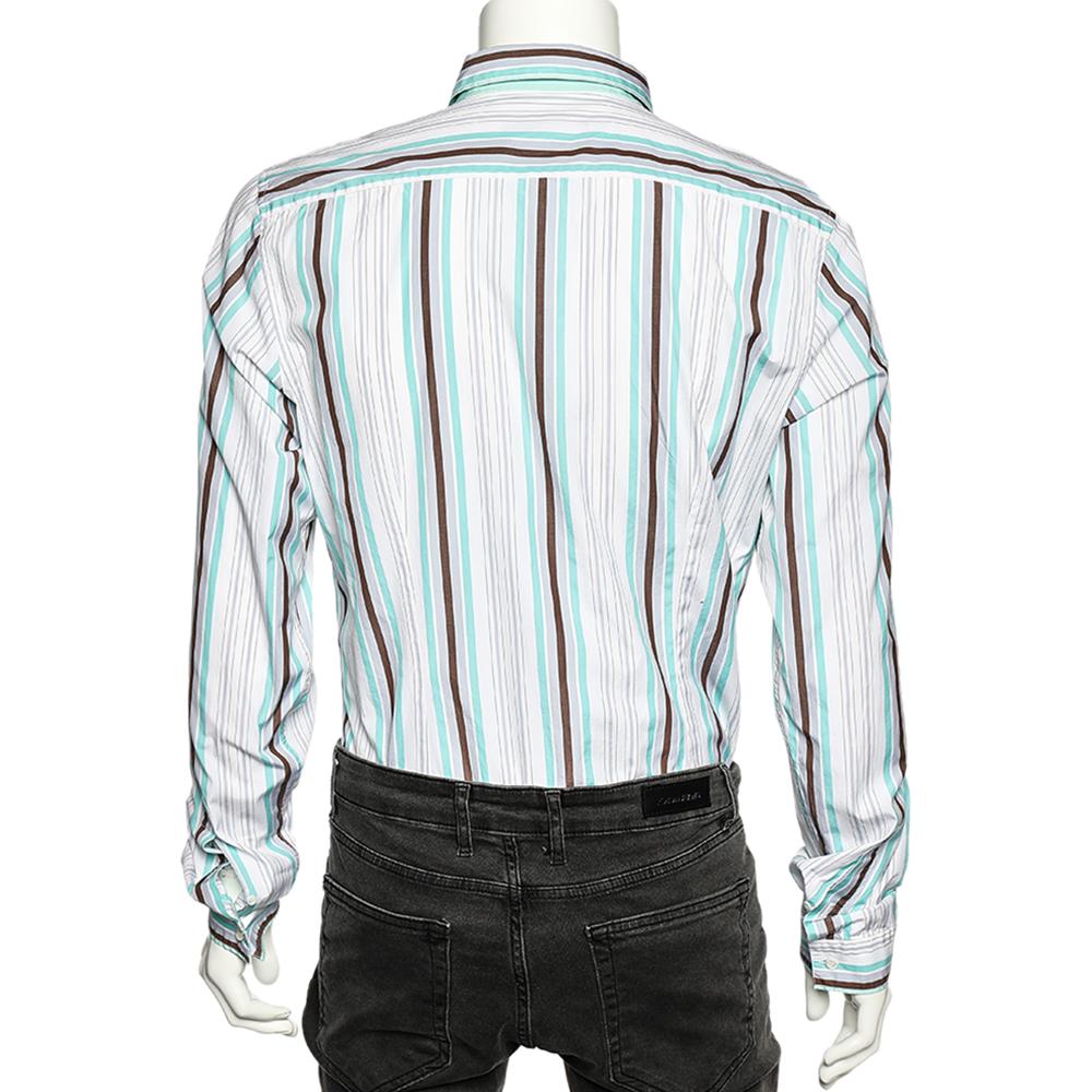 Tailored with precision using cotton, this striped cotton shirt from Gucci will be a staple addition to your closet. It has long sleeves, a simple collar, and full front buttons. It will effortlessly add to your casual style.

